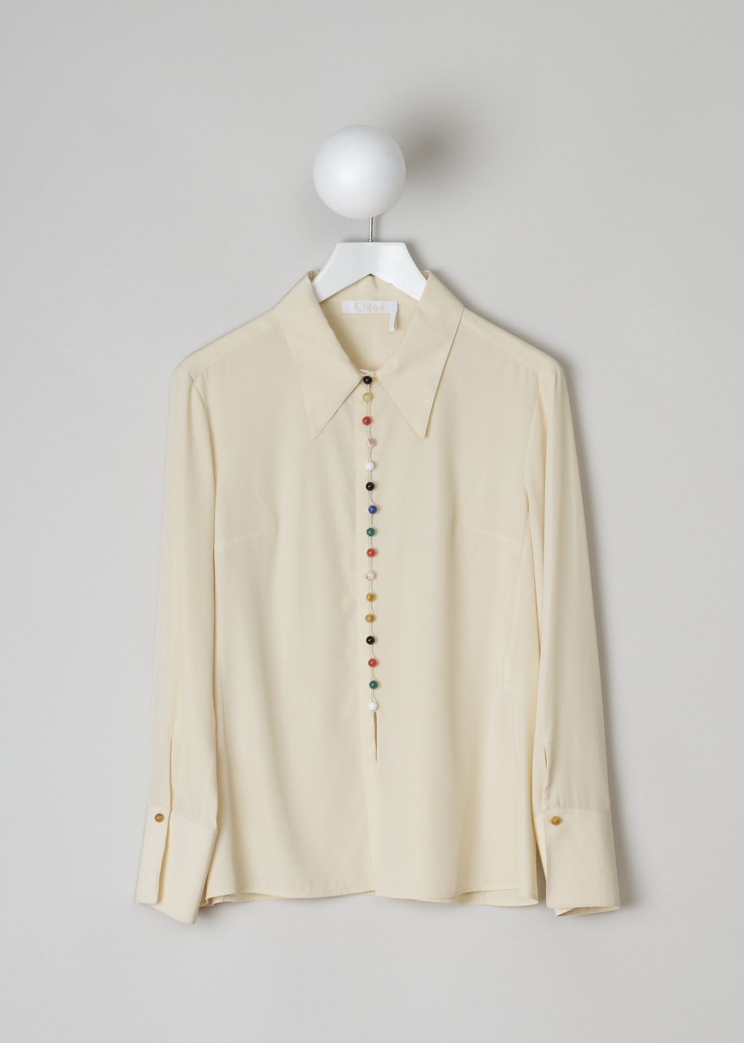 CHLOÉ, BEIGE BLOUSE WITH MULTICOLORED BEAD BUTTONS, CHC22SHT2900524T_SEED_PEARL_BEIGE, Beige, Front, This light beige blouse features a pointed collar and has a front button closure with resin-based bead buttons in various colors. Those same bead buttons can be found on the cuffs. The blouse has a straight hem with a centre slit in the front. 
