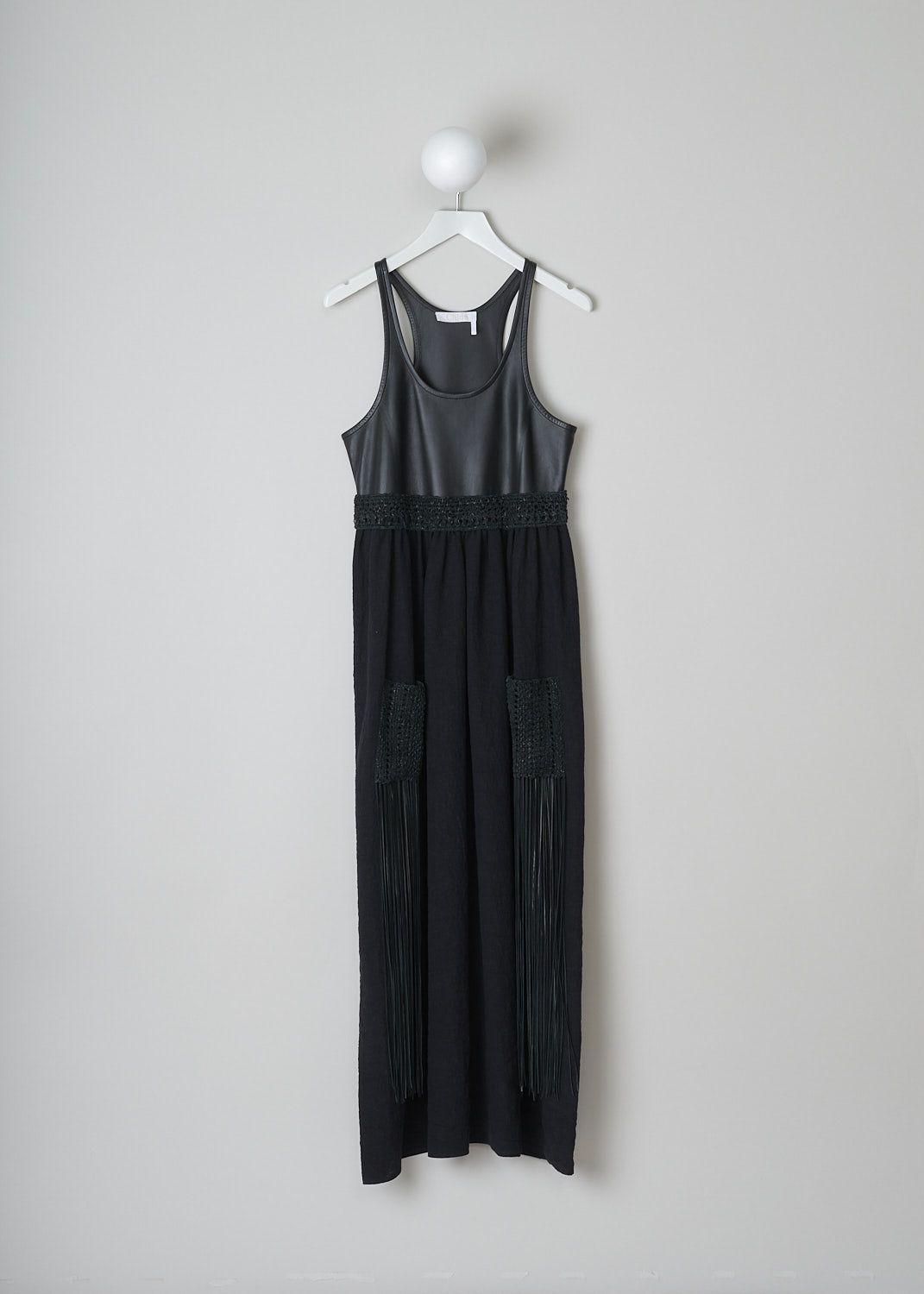 CHLOÉ, SLEEVELESS MULTI-FABRIC DRESS, CHC22SRO55035001_BLACK, Black, Front, This sleeveless midi dress has a black leather bodice with a U-neckline. A braided leather belt separates the bodice from the black linen maxi length skirt. On the skirt, two braided leather patch pockets with long fringes can be found. 

  

