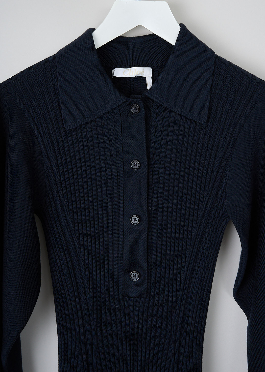 Chloé, Iconic Navy fitted dress, CHC23AMR1366448A_ICONIC_NAVY, Blue, Detail, This Iconic Navy fitted dress has a spread collar with a partial front button placket. The dress is made in a ribbed fabric with smooth balloon sleeves and a flared skirt. The dress has a straight hemline. 
