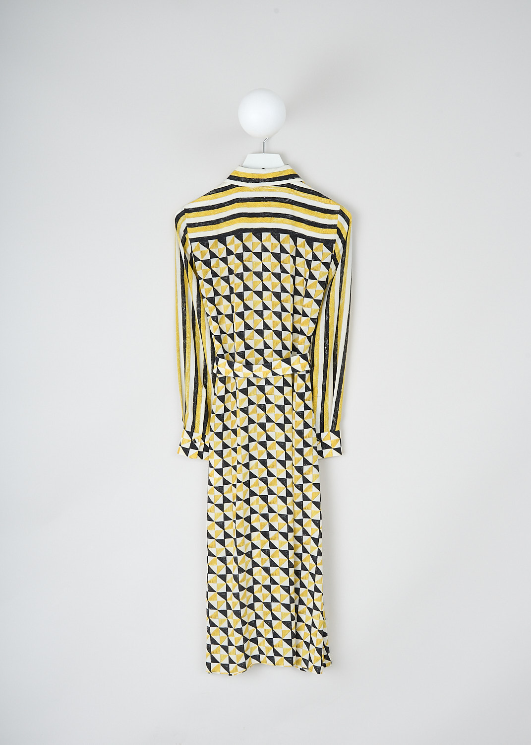 Chloé, Yellow geometric-print shirt dress, CHC23ARO393139CB_MULTICOLOR_2, Yellow, Print, Back, This maxi shirt dress has a geometric print in yellow, white and black. The bodice has a spread collar and a partial front button placket. The long sleeves have buttoned cuffs. A matching fabric belt can be used to cinch in the waist. Knife pleats run along the length of the dress and stop midway on the skirt. A concealed side zip functions as the closure. 

