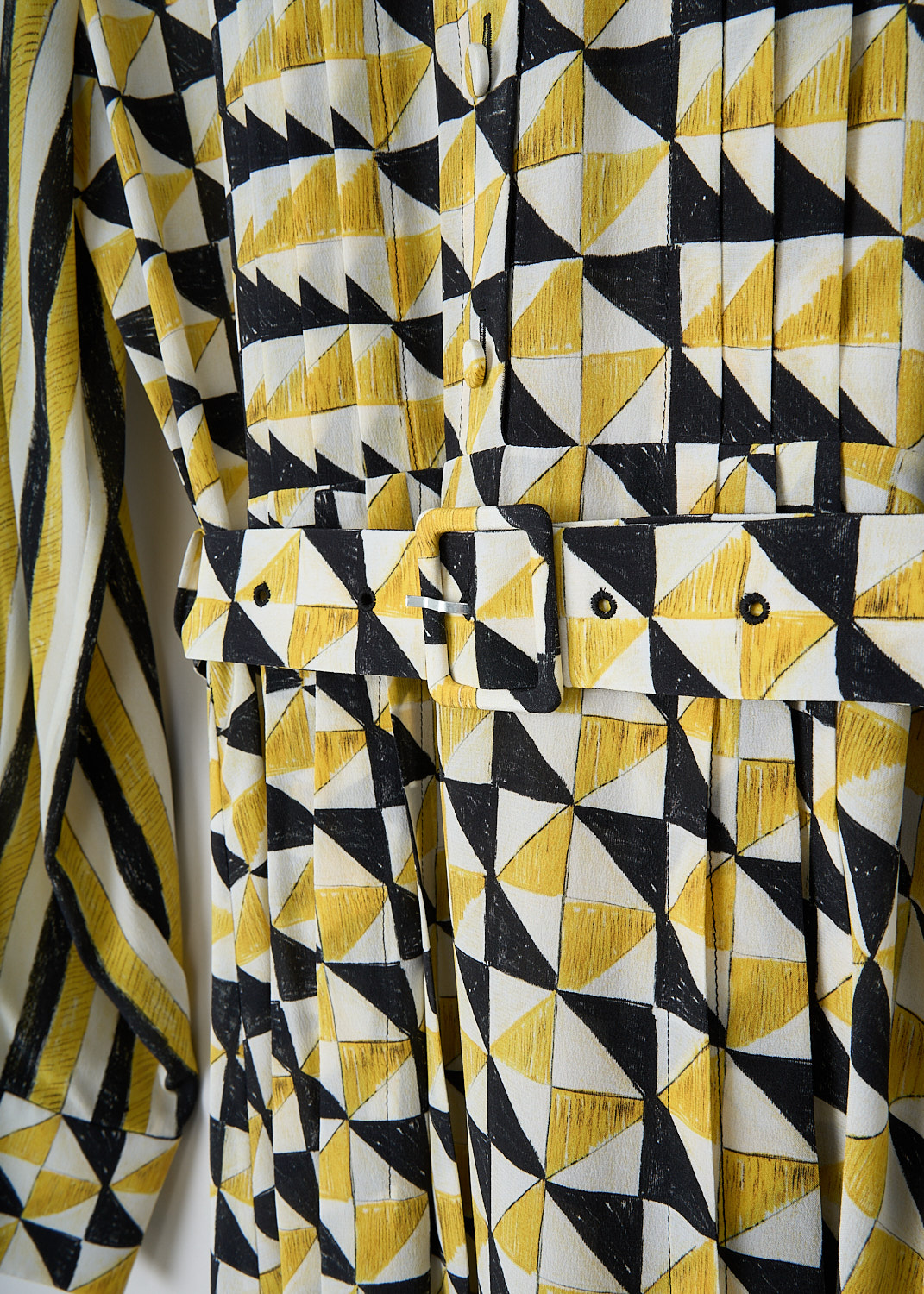 Chloé, Yellow geometric-print shirt dress, CHC23ARO393139CB_MULTICOLOR_2, Yellow, Print, Detail, This maxi shirt dress has a geometric print in yellow, white and black. The bodice has a spread collar and a partial front button placket. The long sleeves have buttoned cuffs. A matching fabric belt can be used to cinch in the waist. Knife pleats run along the length of the dress and stop midway on the skirt. A concealed side zip functions as the closure. 

