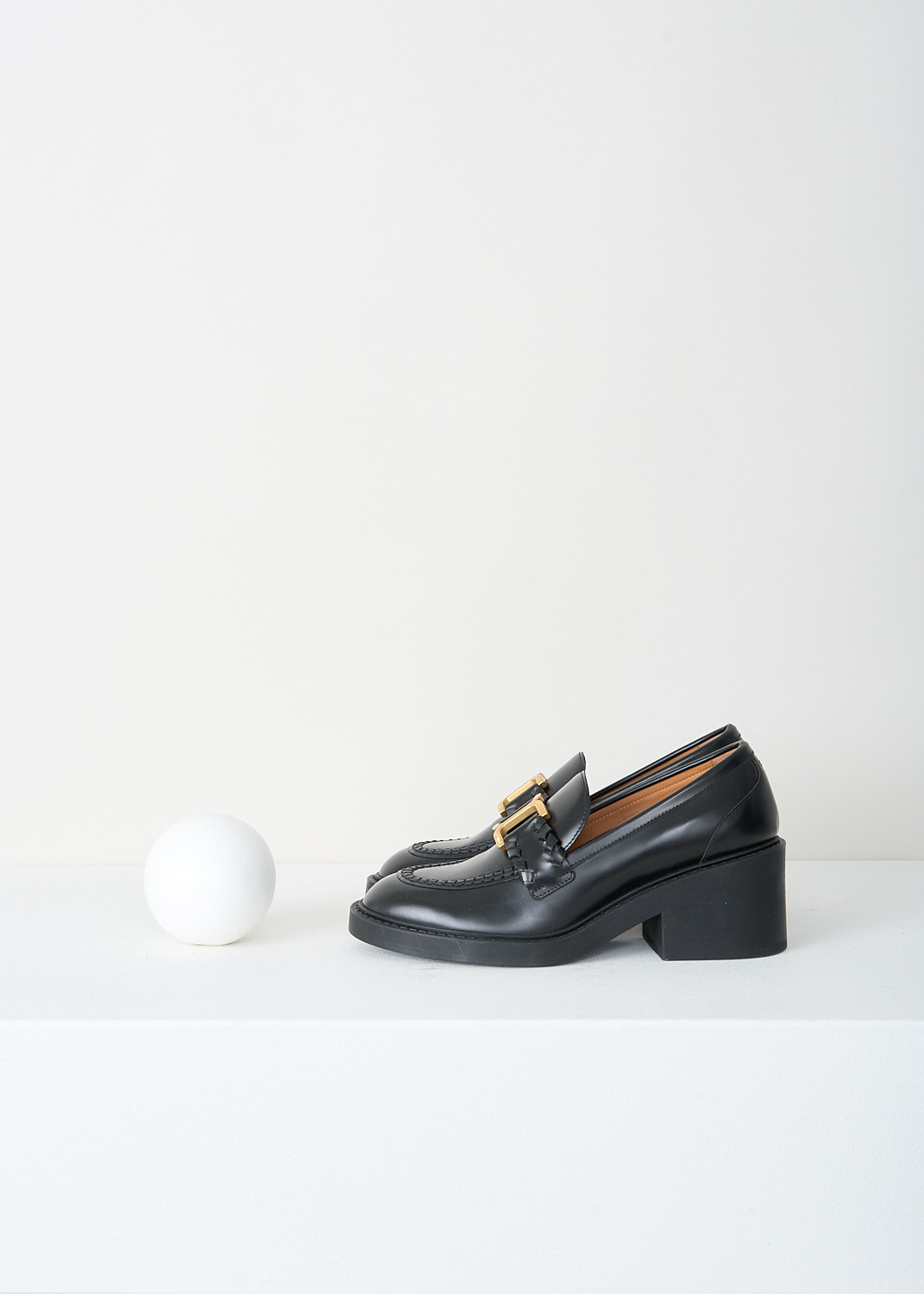 Chloé, Black Marcie loafer with gold-tone buckle, CHC23W942EY001_BLACK, Black, Side, These black heeled Marcie loafers have an almond toe with a gold-tone buckle across the vamp. These loafers have a blocked heel.
 
