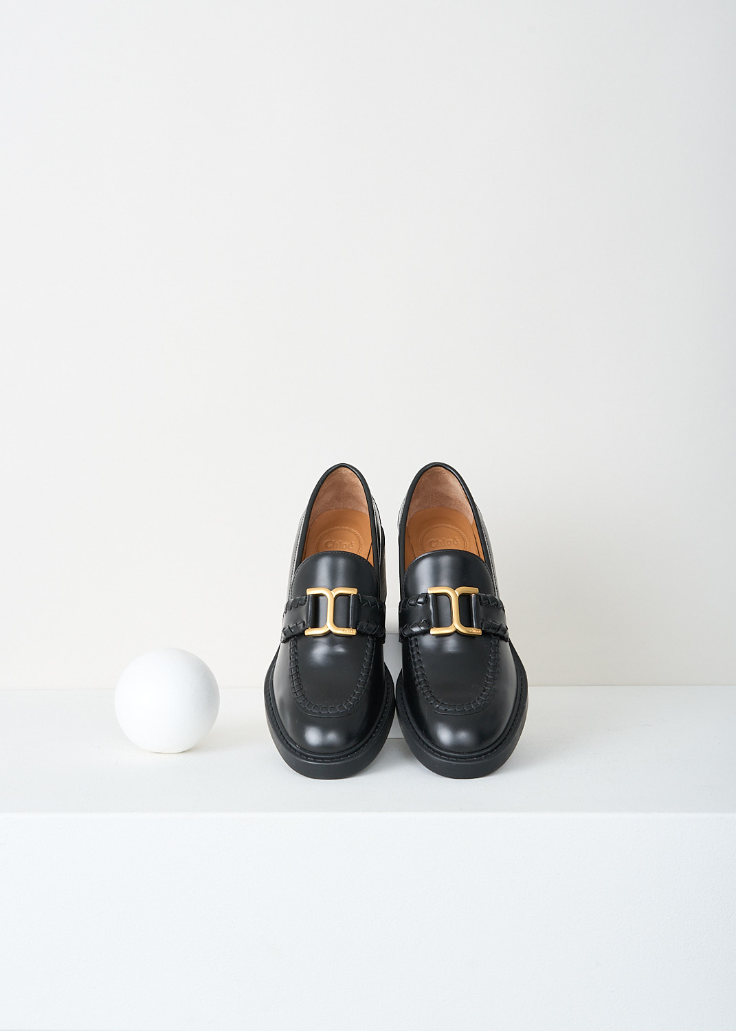 Chloé, Black Marcie loafer with gold-tone buckle, CHC23W942EY001_BLACK, Black, Top, These black heeled Marcie loafers have an almond toe with a gold-tone buckle across the vamp. These loafers have a blocked heel.
 
