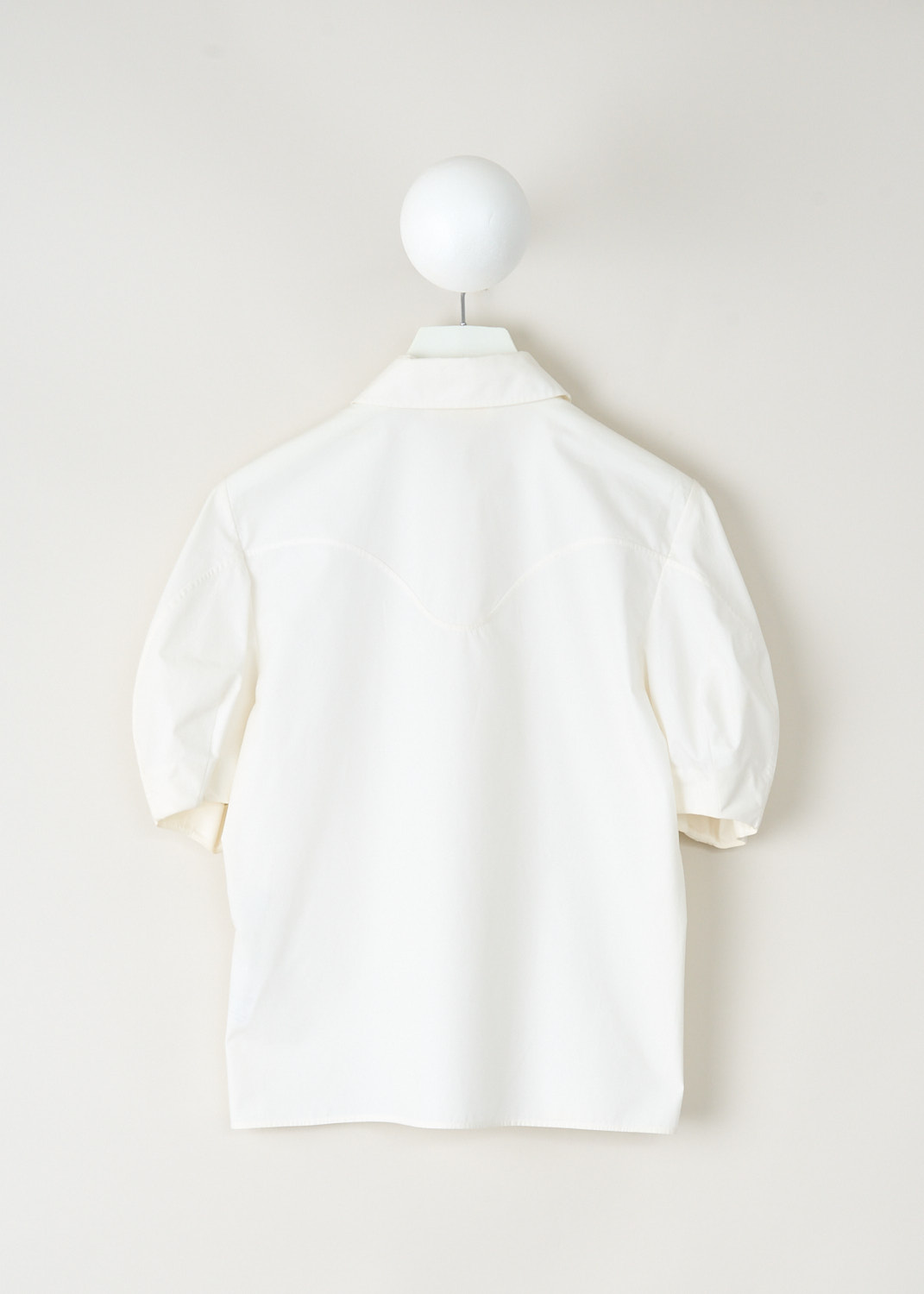 Back view of Chloé white blouse with balloon sleeves and embroidered detailing, available at Kiki's Stocksale designer outlet in Maastricht.