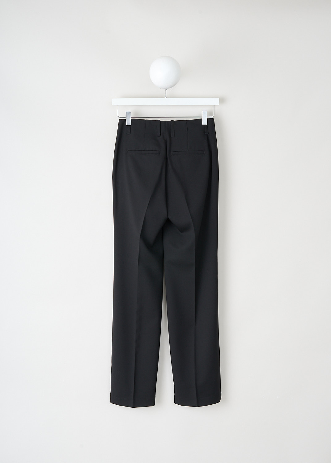 Back view of black slim fit trousers with tailored silhouette at Kiki's Stocksale Maastricht designer outlet.