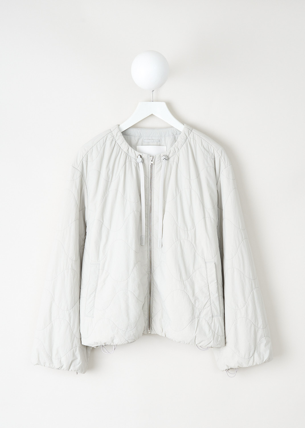 Closed lightweight quilted nylon bomber jacket with short relaxed fit, wide sleeves, zip closure and drawstrings at Kiki's Stocksale Maastricht designer outlet.