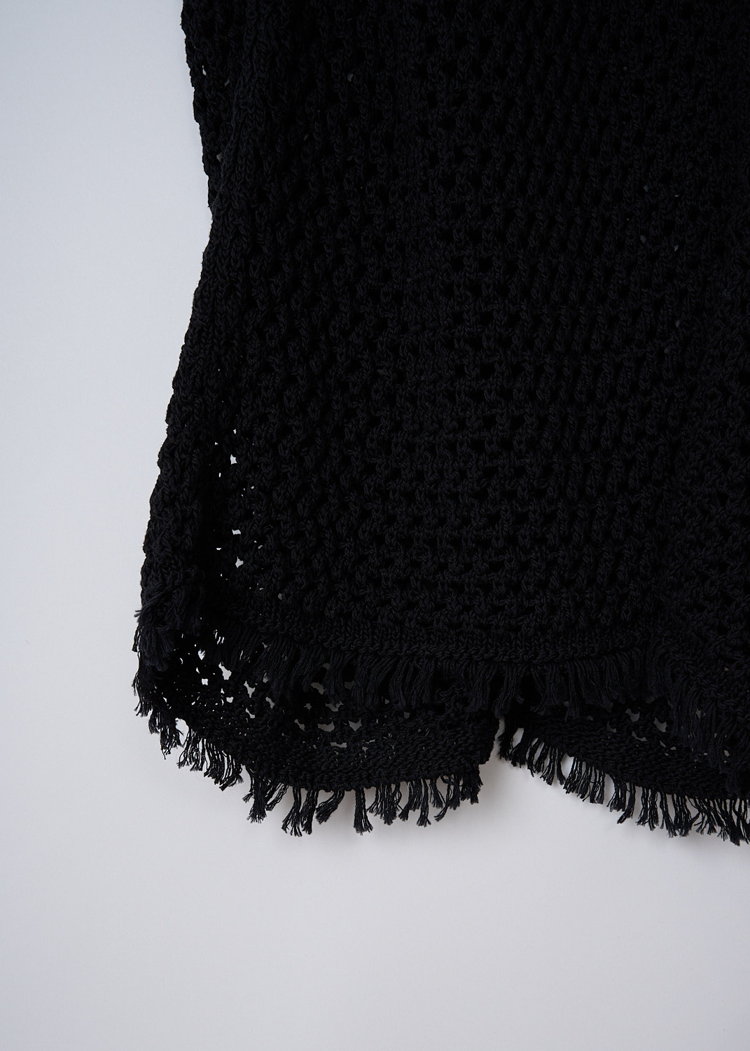 DRIES VAN NOTEN, BLACK OPEN-KNIT MAXI SKIRT, TIBBA_SHORT_6713_WK_SKIRT_BLACK, Black, Detail, This black open-knit maxi skirt has a broad elasticated waistband. The skirt has a straight hemline with a frilled trim.
