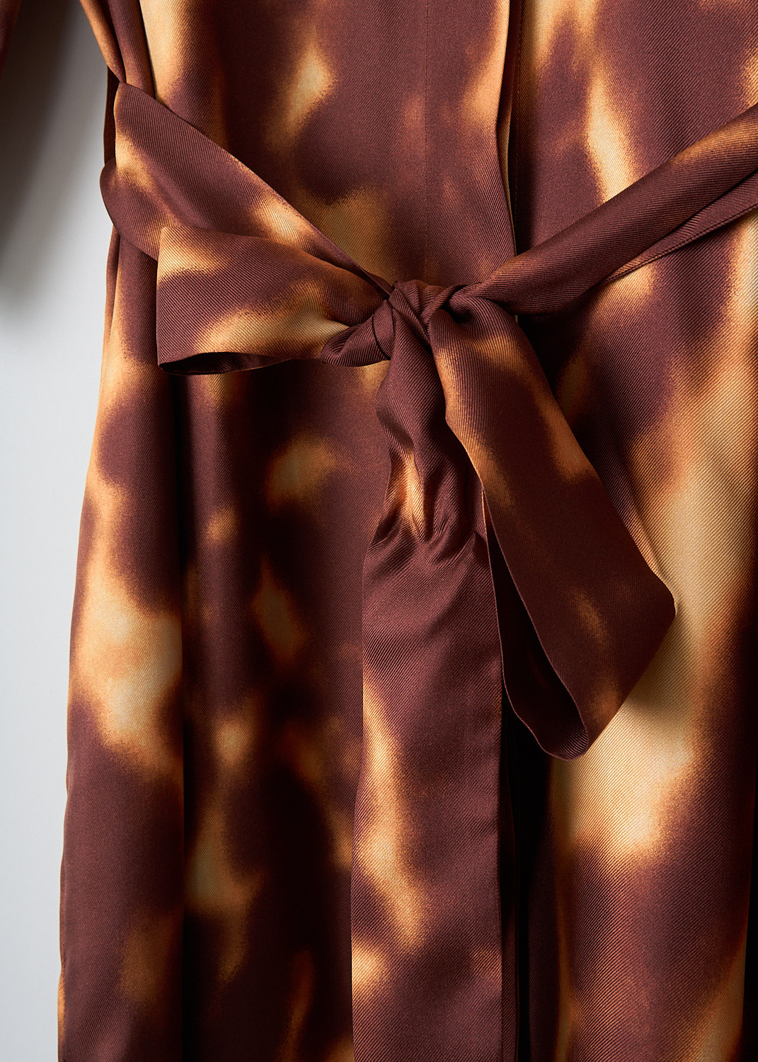 Dries van Noten, Doralia dress in Rust, DORALIA_1035_WW_DRESS_701_RUST, Brown, Orange, Print, Detail 1, This silk Doralia shirt dress has a rust-colored tie dye pattern. The dress has a spread collar and a concealed front button closure. On the front, the dress has a single breast pocket. Both the short sleeves and the straight hem have a contrasting trim. The dress comes with a matching fabric belt to cinch in the waist.
