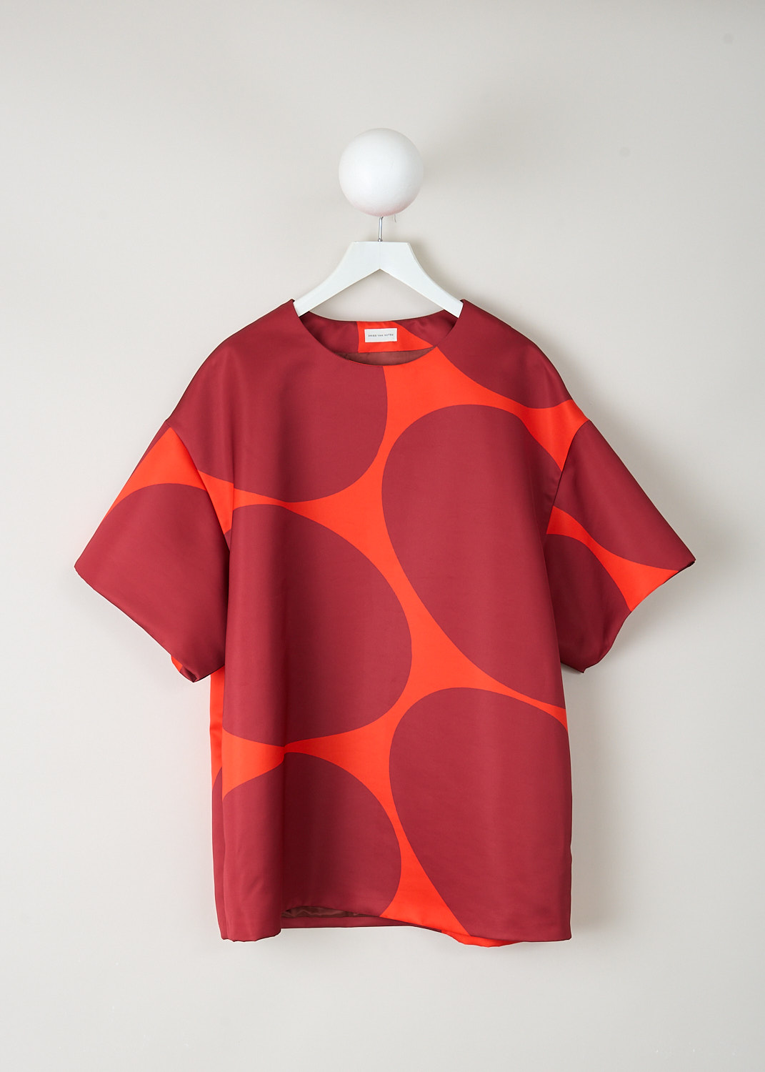 Dries Van Noten Dekkora oversized mini dress with orange base and enlarged red dot print, round neckline and short sleeves, designer womenswear at Kiki’s Stocksale Maastricht