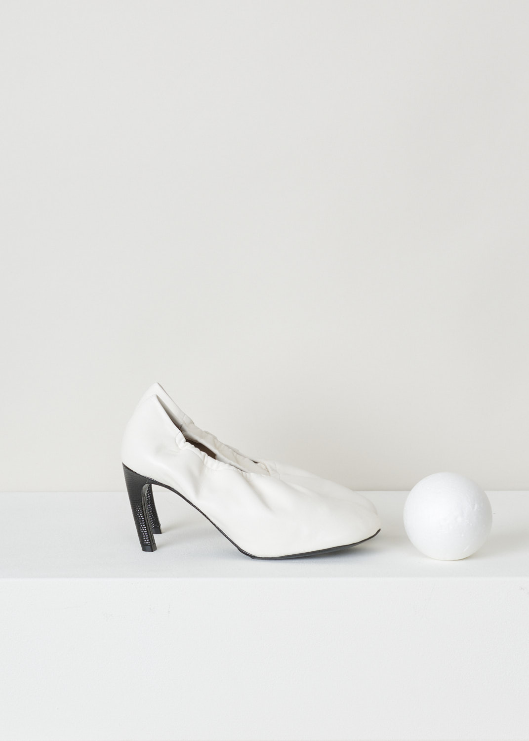 Dries van Noten, Off-white pump with an elastic fold-over vamp, WS211_138_H80_QU155_white001, side, white black, Off-white pumps made entirely out of soft and smooth calfskin. A quirky feature on this model is the elastic topline which folds over the toe vamp, ensuring a unique design feature. The toe vamp comes in a square format. Another lovely feature on this model is the heel which is cover in black embossed leather. 

Heel height: 7.5 cm / 2.95 inch.