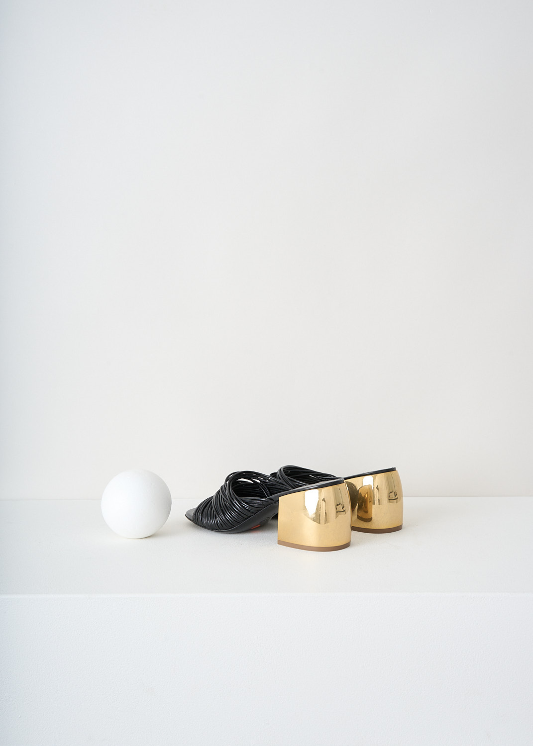 Back view of the black mule pumps showing gold-tone block heel by Dries Van Noten, available at designer boutique Kiki's Stocksale in Maastricht.