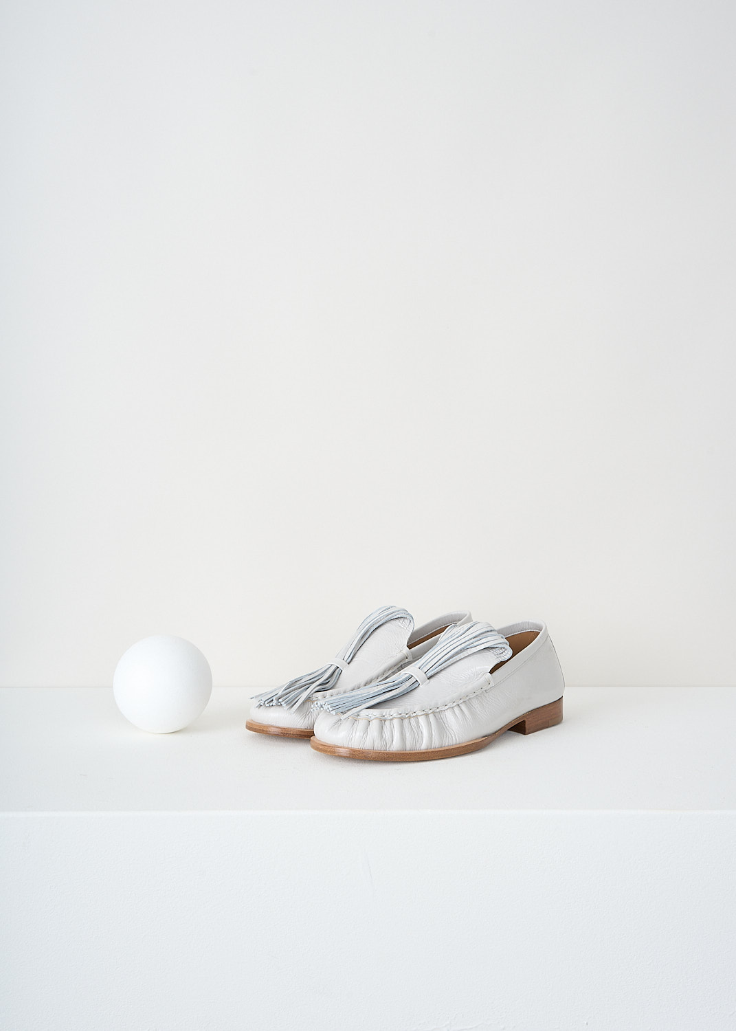 Dries van Noten, Off-white loafers with exaggerated tassels, 
WS241_1116_150_008_OFF_WHITE, White, Front, These off-white loafers have exaggerated tassels that curl  back to the toe and are held in place on the vamp. These loafers are pleated along the seams and have tan stacked soles.