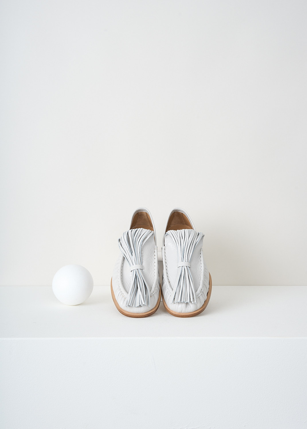 Dries van Noten, Off-white loafers with exaggerated tassels, 
WS241_1116_150_008_OFF_WHITE, White, Top, These off-white loafers have exaggerated tassels that curl  back to the toe and are held in place on the vamp. These loafers are pleated along the seams and have tan stacked soles.