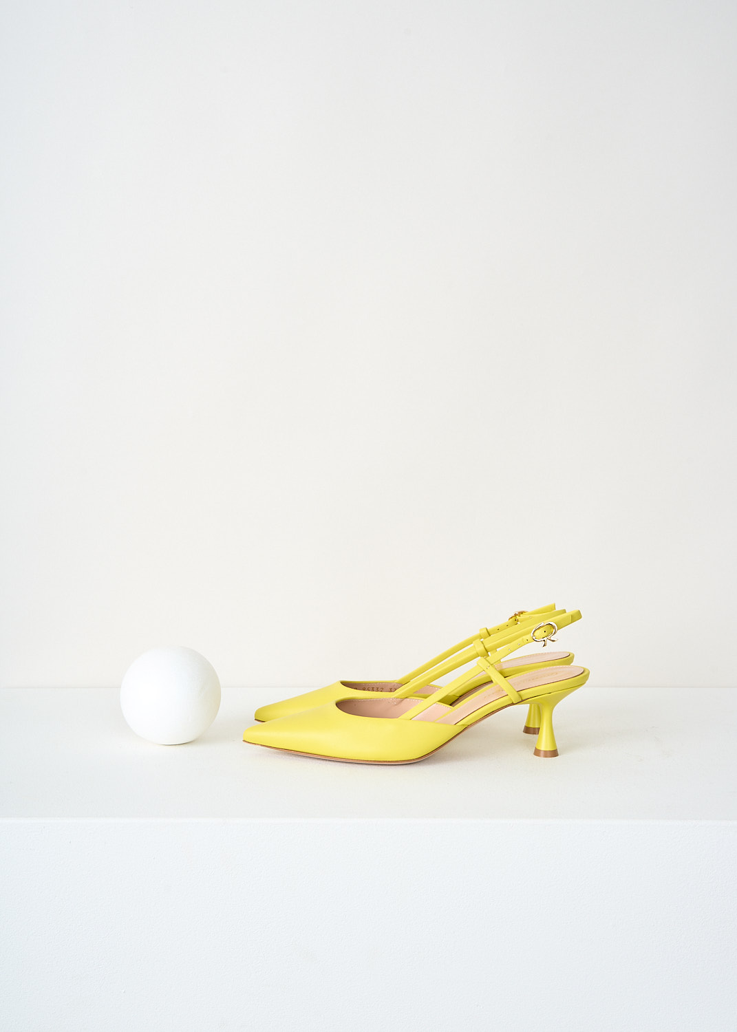 Gianvito Rossi yellow leather slingback pumps with pointed toe and elegant kitten heels, available at Kiki's Stocksale designer outlet Maastricht.