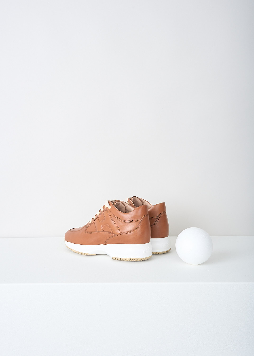 Hogan, Brown leather Interactive sneakers, HXW00N00010_ZKA_S003, Brown, Back, These brown leather leather sneakers feature front lace-up fastening with white laces. These sneakers have a almond shaped toe and a white rubber sole. On the sides, the sneakers have the brand's H logo incorporated in the design.
