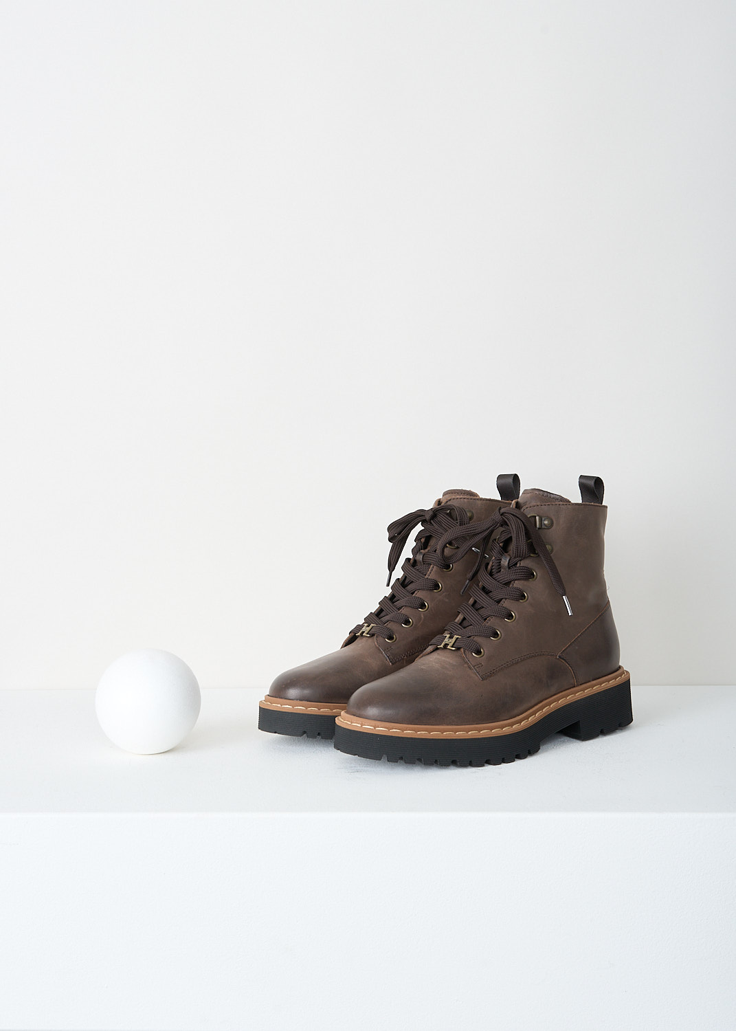 Hogan, Tabacco brown lace-up boots, HXW5430DR52_RVJ_S810, Brown, Front, These Tabacco brown ankle boots have a classic round toe and a lace‑up closure with a subtle 'H' logo detail. These boots have black rubber soles with a light caramel-colored trim. 
