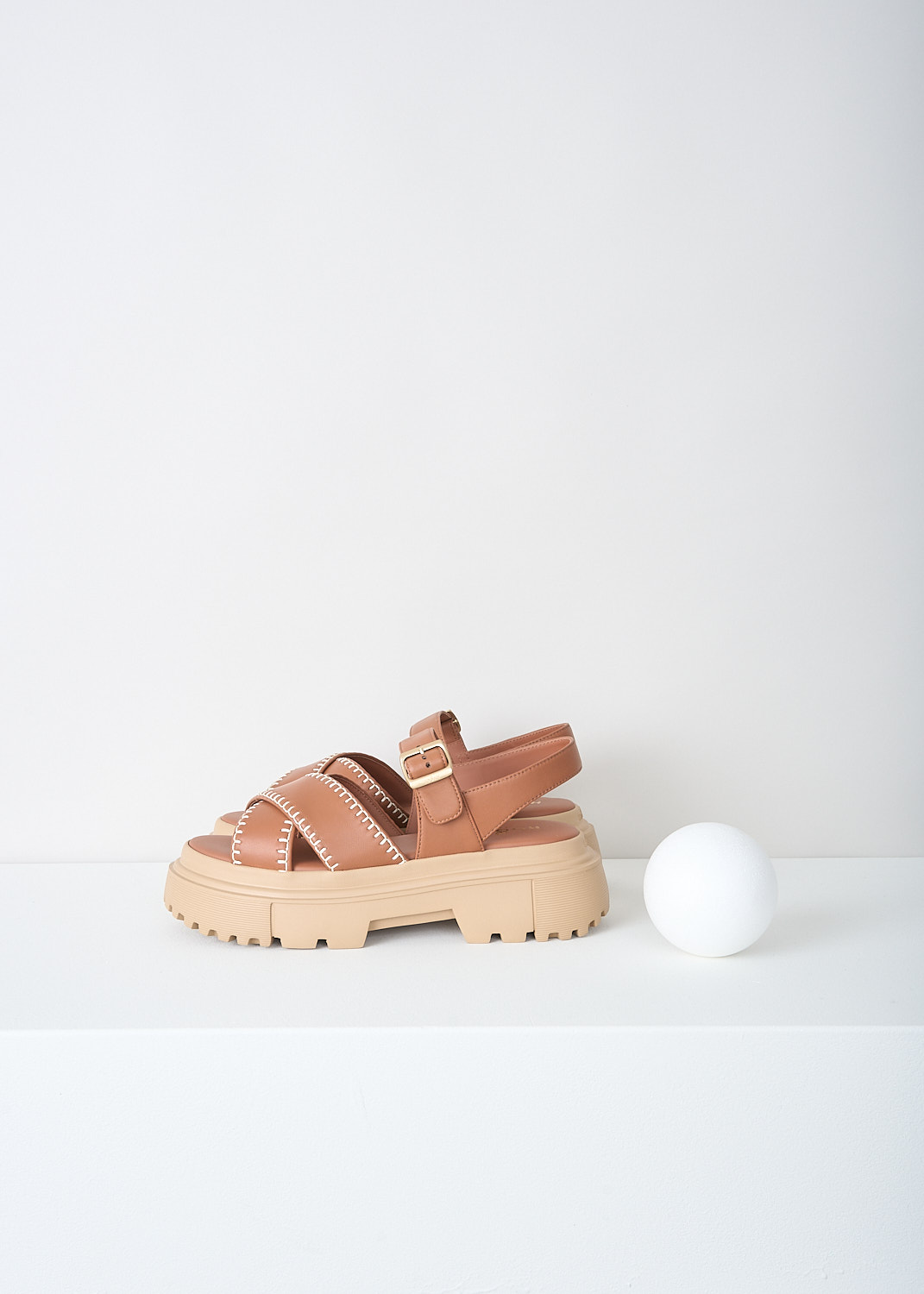 Hogan, Chunky brown sandals with contrast stitching, HXW6440FJ30_LE9_S003, Brown, Side, These chunky brown leather platform sandals have an adjustable ankle strap with a gold-tone buckle. These sandals have a broad strap across the vamp with contrasting stitching, a round open-toe and chunky ridged soles.
 
