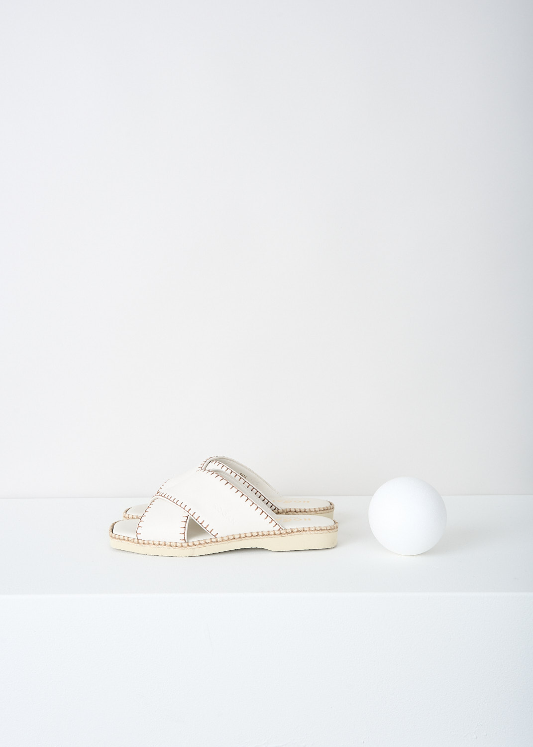 Hogan, Off-white leather slides with contrast stitching, HXW6600FH40_LE9_B013, White, Side, These flat slip-one slides have an off-white criss-cross strap with contrasting stitching. 

