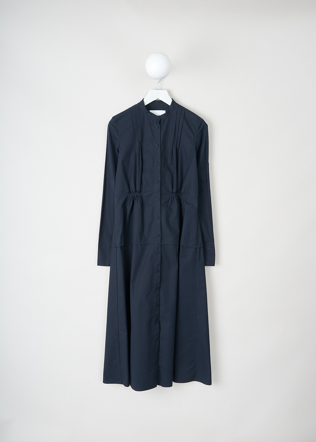 Jil Sander, Navy blue long-sleeve maxi dress, J04CT0002_J45002_401_NAVY, Blue, Front, This navy blue long-sleeve maxi dress has a mandarin collar and a front button closure. The long sleeves have buttoned cuffs. The front and back have pleated detailing. The dress has a slightly flared skirt.
