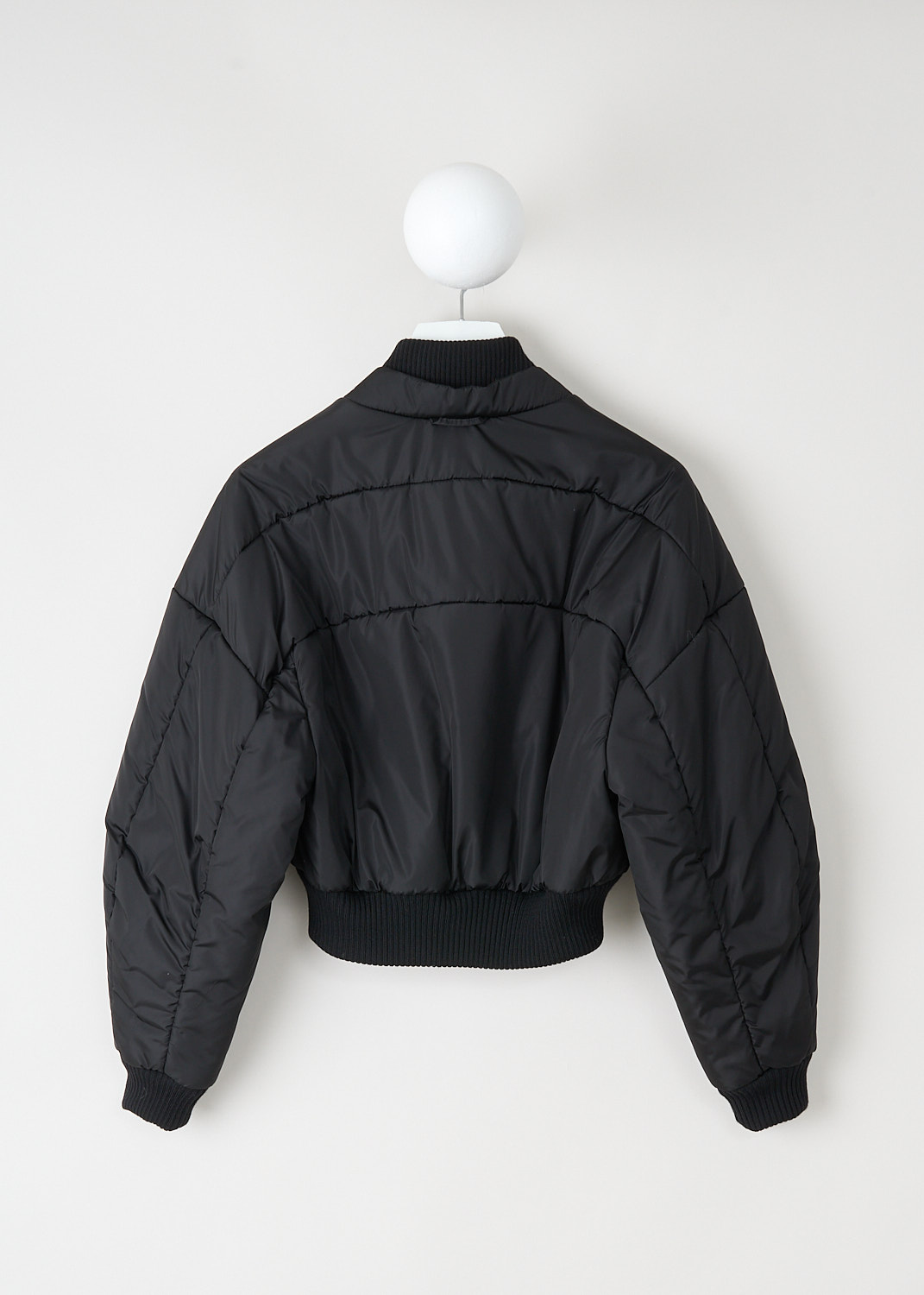 Back view of Kassl Editions cropped bomber jacket with dropped shoulders and sculpted cropped silhouette.