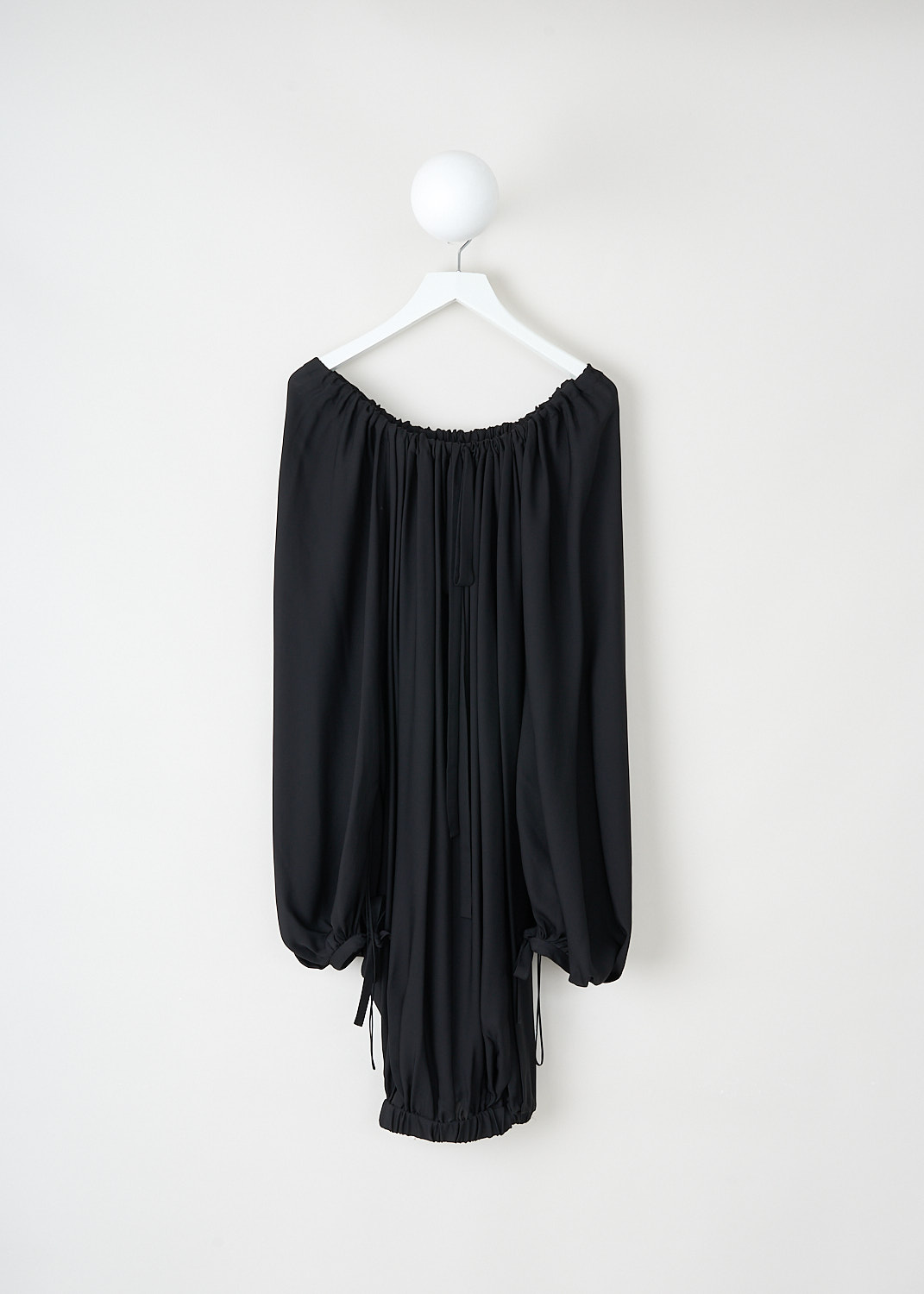 Khaite, Black loose top with boat neckline, NASH_TOP_2346338_200_BLACK, Black, Back, This black loose Nash top has a gathered boat neckline with a tie closure in the back. The top has long balloon sleeves with tied cuffs. The top has a gathered elasticated hem.
