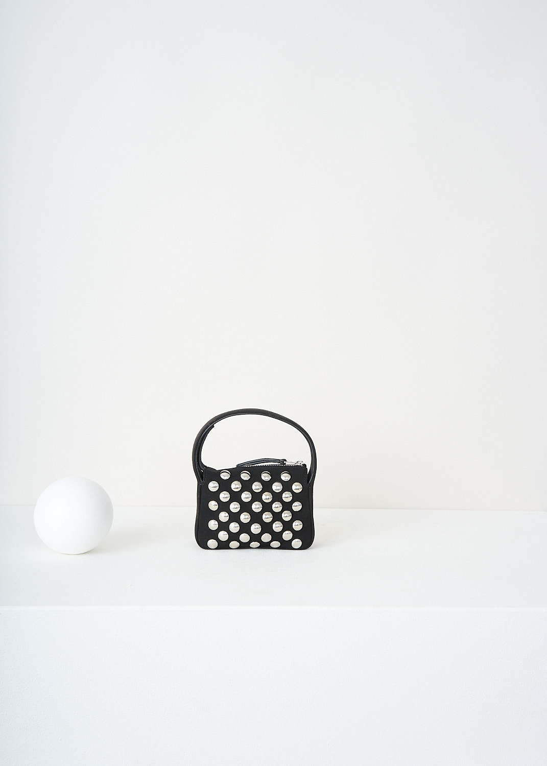 Khaite, Elena nano handbag with silver studs in Black, ELENA_NANO_W_STUD_H5011_849_200_BLACK, Black, Silver, Front, This Elena nano handbag with silver studs in Black has a single broad strap. The boxy bag has a top-zip closure that opens up to a small compartment.

