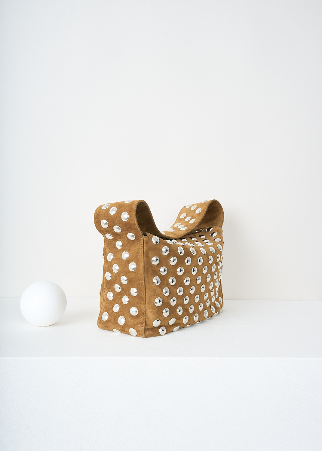 Khaite, Elena shoulder bag with silver studs in Mud, 
ELENA_SHOULDER_BAG_H2025_849_737_MUD, Brown, Side, This Elena shoulder bag with silver studs in the color Mud has a single broad shoulder strap. The boxy bag has a top-zip closure that opens up to its spacious compartment with, to one side, a slip pocket. 