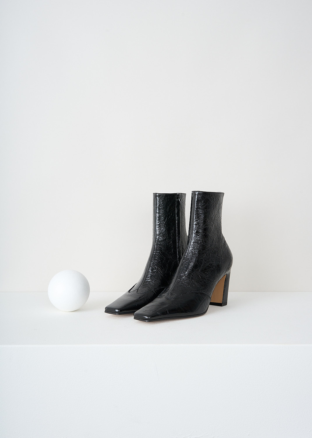 Khaite, Navada ankle stretch boots in Black, NEVADA_ANKLE_BOOT_F1067_858_200_BLACK, Black, Front, These Navada ankle stretch boots in black are made in patent leather with a crackled finish. These boots have a side zip, a square nose and a curved block heel. 
