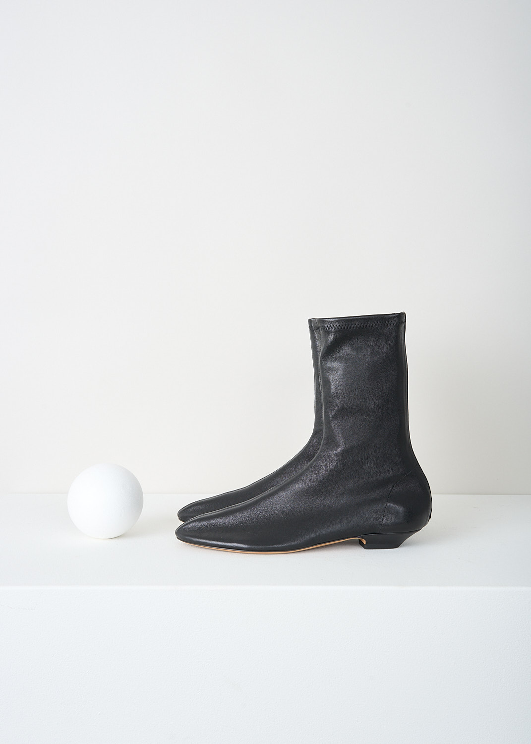 Khaite, Apollo flat boots in Black, APOLLO_FLAT_BOOT_F1082_836_200_BLACK, Black, Side, These Apollo flat boots are made from supple leather and have a close fit with a zip on the heel. The boots have a round nose and a small heel. 

