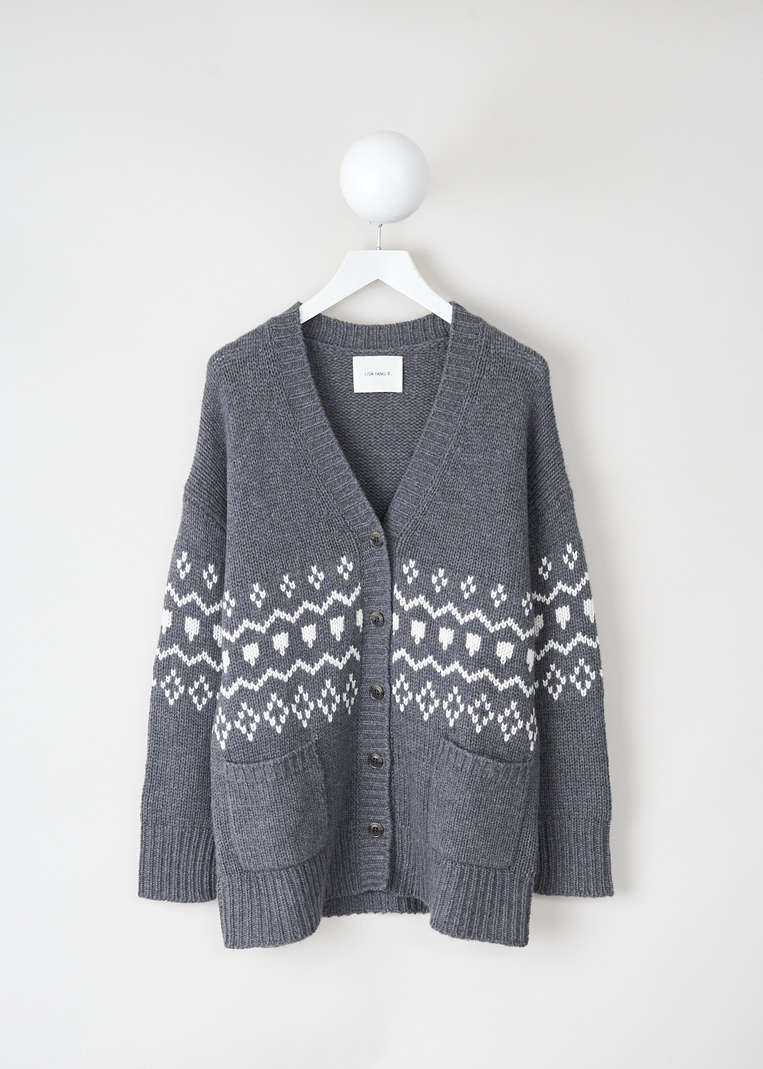Lisa Yang, Greyson cardigan in Graphite/cream, 2023254_GREYSON_CARDIGAN_GRAPHITE_CREAM, Grey, White, Print, Front, This Greyson cardigan has a Graphite grey base color with a cream jacquard print. The cardigan has a V-neckline, long sleeves and a front button closure. The neckline, cuffs and hemline have a ribbed finish. On the front, the cardigan has two patch pockets.
