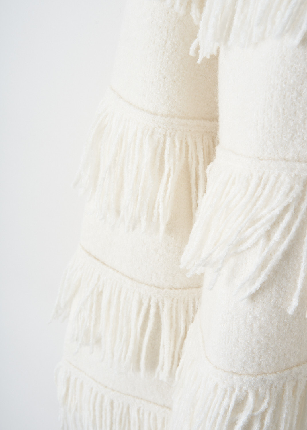 Lisa Yang, Cream bouclé Agneta sweater, 2024277_AGNETA_SWEATER_CREAM_BOUCLE, White, Detail, This Cream bouclé Agneta sweater has a round neckline and long sleeves. Fringe-trims runs horizontally along the front and back. The sweater has an oversized fit. 
