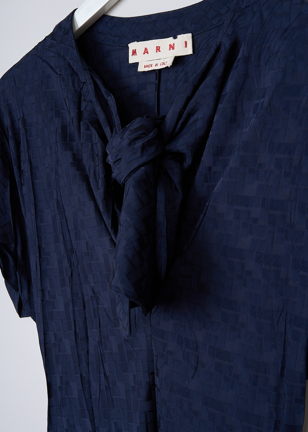 MARNI, INK BLUE FLUID JACQUARD MAXI DRESS, ABMA0871A0_UTV902_00B80, Blue, Detail, This Ink blue fluid maxi dress has a geometric jacquard print. The dress has a bow-tie neckline with a deep V. The short sleeves have tie cuffs. The long skirt flares out slightly at the bottom. The dress is fully lined.
