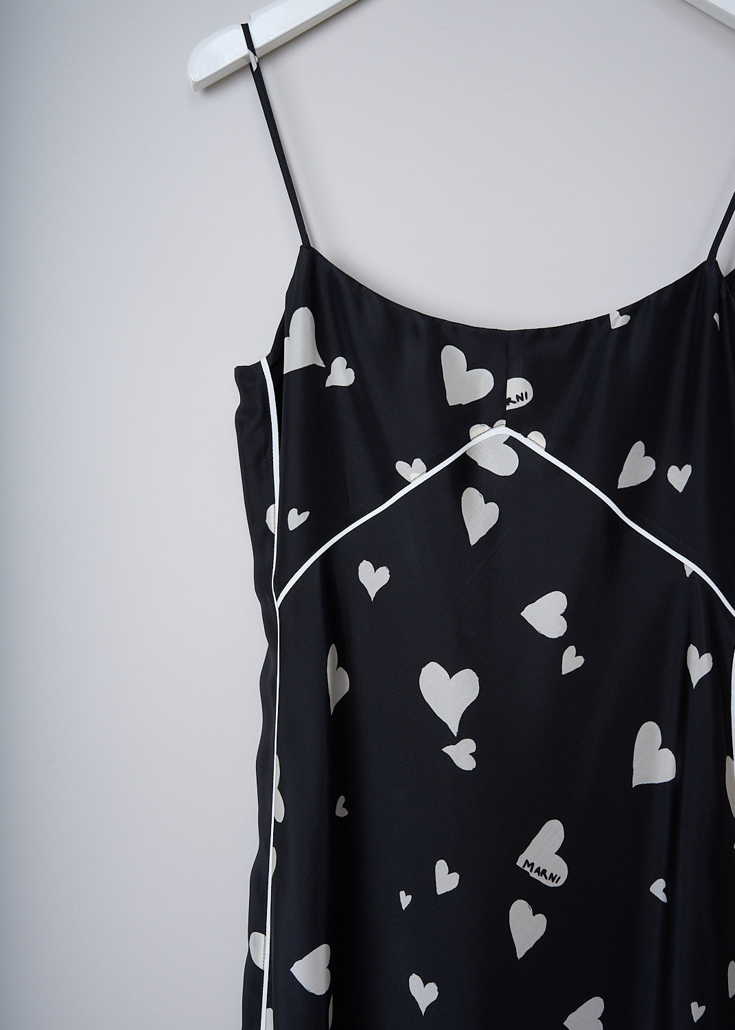 MARNI, BUNCH OF HEARTS SILK SLIP DRESS, ABMA1076I0_UTSG03_BHN99, Black, White, Print, Detail, This Bunch Of Hearts silk midi slip dress has a black base color with a white heart print. The slip-on dress has spaghetti straps and a round neckline. White pipping runs along the seams throughout. The straight hem hits below the knee. The dress is fully lined. 
