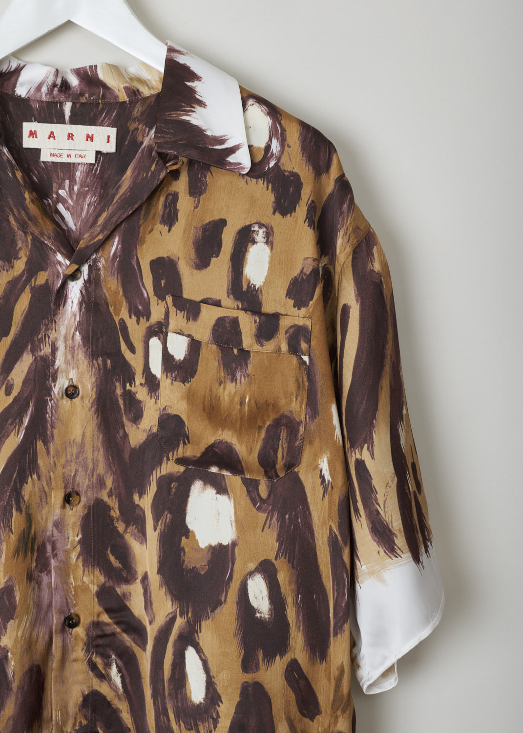 MARNI, ANIMAL PRINT BLOUSE WITH SHORT SLEEVES, CAMA0501A0_UTV912_WBM20, Brown, Print, Detail, This loose fitting short sleeved blouse is made in a satin animal print. This blouse features a classic collar, a single breast pocket and front button fastening. This model has an asymmetrical finish, meaning the back is a little longer than the front.
