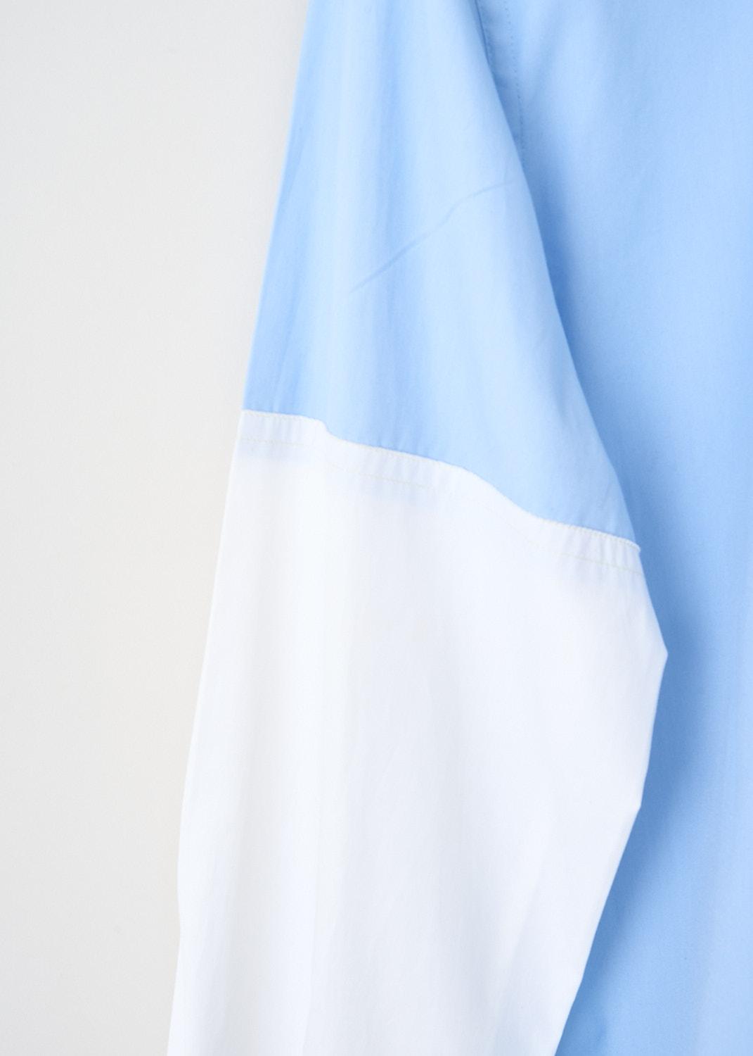 Marni, Blue shirt with contrasting sleeves, CAMA0544QX_UTC223_00B50, Blue, White, Detail 1, This bi-color blouse has a classic collar and a front button closure. The long contrasting white sleeves have buttoned cuffs. in the front, the blouse has a single breast pocket. The brand's logo can be found embroidered on the back of the neck.
