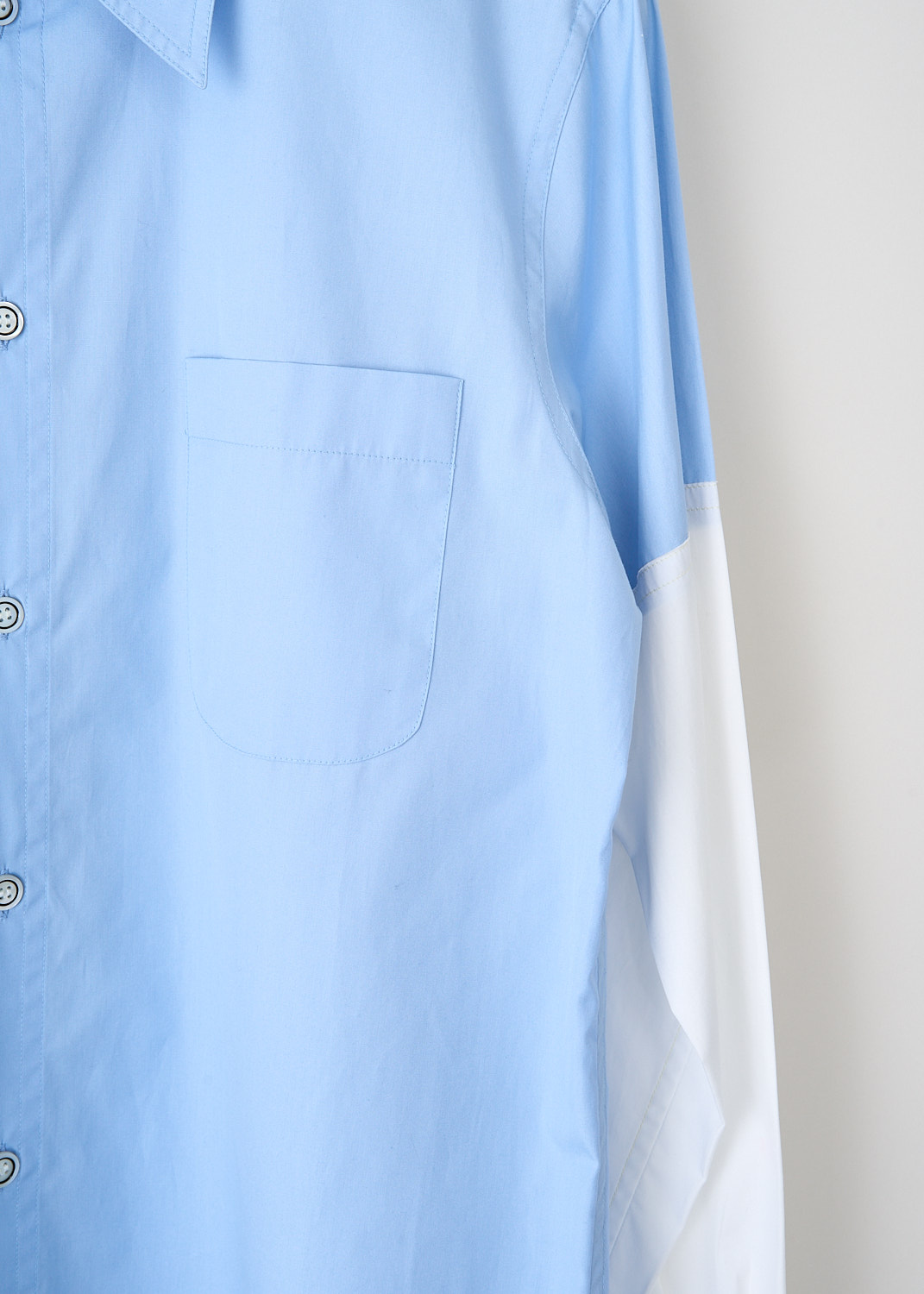 Marni, Blue shirt with contrasting sleeves, CAMA0544QX_UTC223_00B50, Blue, White, Detail, This bi-color blouse has a classic collar and a front button closure. The long contrasting white sleeves have buttoned cuffs. in the front, the blouse has a single breast pocket. The brand's logo can be found embroidered on the back of the neck.
