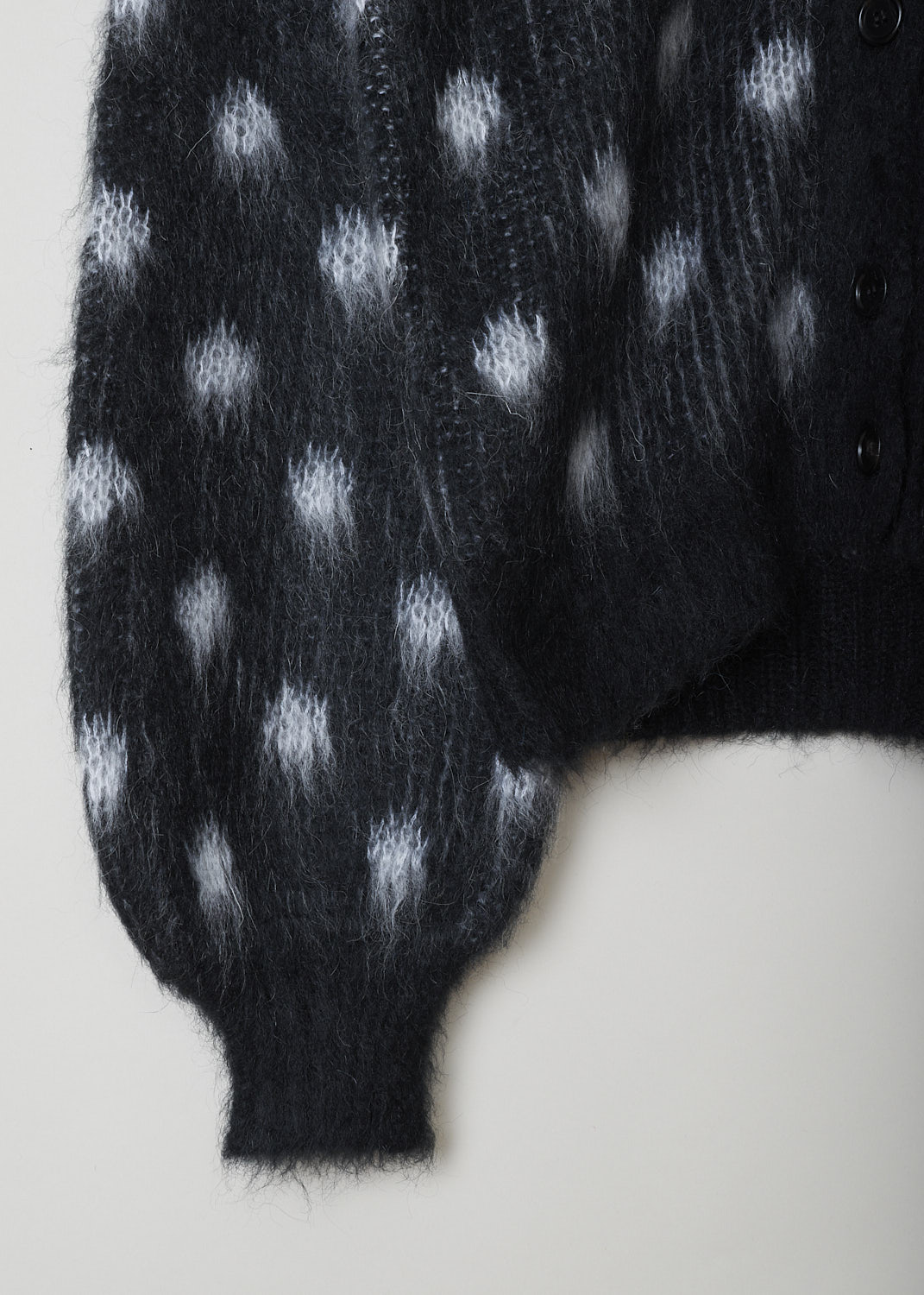 MARNI, BRUSHED DOTS FUZZY WUZZY CARDIGAN, CDMD0326Q0_UFU160_DON99, Black, Print, Grey, Detail 1, This brushed dots Fuzzy Wuzzy cardigan has a black V-neckline with a front button closure. The sweater has a two-tone dot pattern in black and grey. The long balloon sleeves have ribbed cuffs. That same ribbed finish can be found on the hemline.
