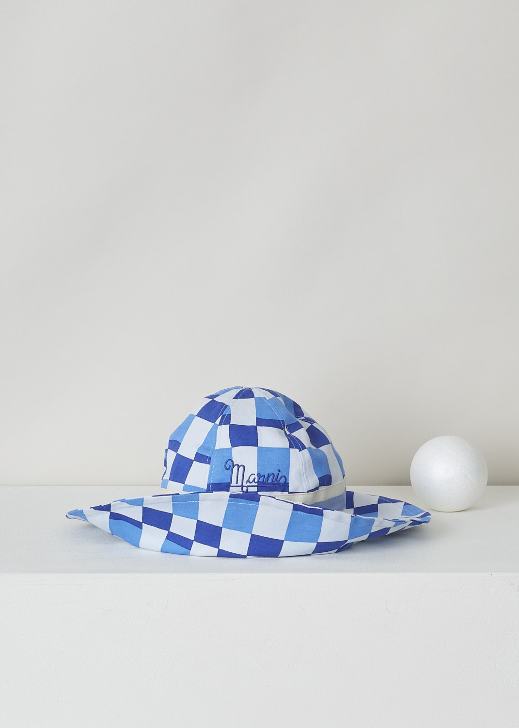 MARNI, BLUE CHECKERED BUCKET HAT, CLMC0039QX_UTC138_IDB19, Print, Blue, Front, This blue checkered bucket hat has a broad blue and white striped band above the brim. The brand's lettering can be found embroidered on the front. 

circumference: 60 cm / 23.6 inch
