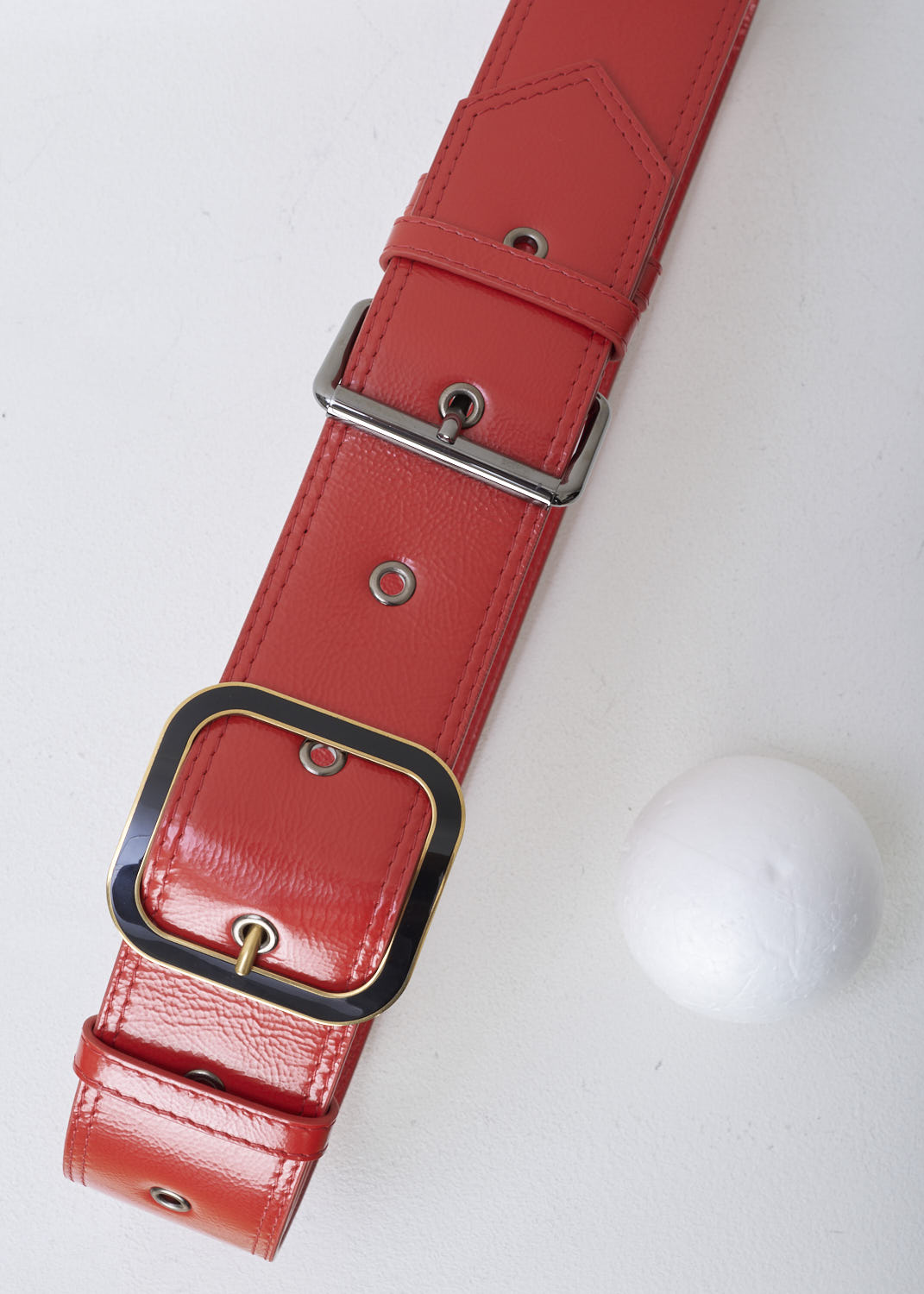 MARNI, BROAD RED BELT WITH A DOUBLE BUCKLE DETAIL, CNMO0050Q0_P2904_Z2F67, Red, Front 1, Broad naplak leather belt in a scarlet red color. The belt has a double buckle detail: one buckle is silver, the other is black with a gold trim. 
