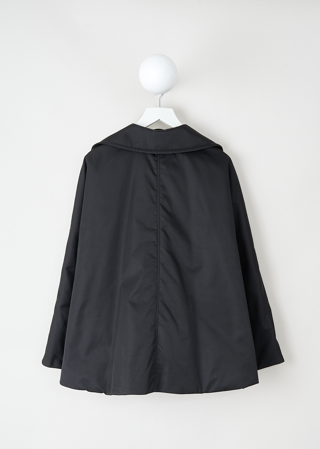Marni, Twill cape coat in black, CPMA0251SW_UTN923_00N99, Black, Back, This short black twill-weave cape coat has a notched lapel and a front button closure. The coat has long sleeves and a high-low hemline.  On the front, the coat has two slanted pockets. The coat has a loose fit. The coat is fully lined.

