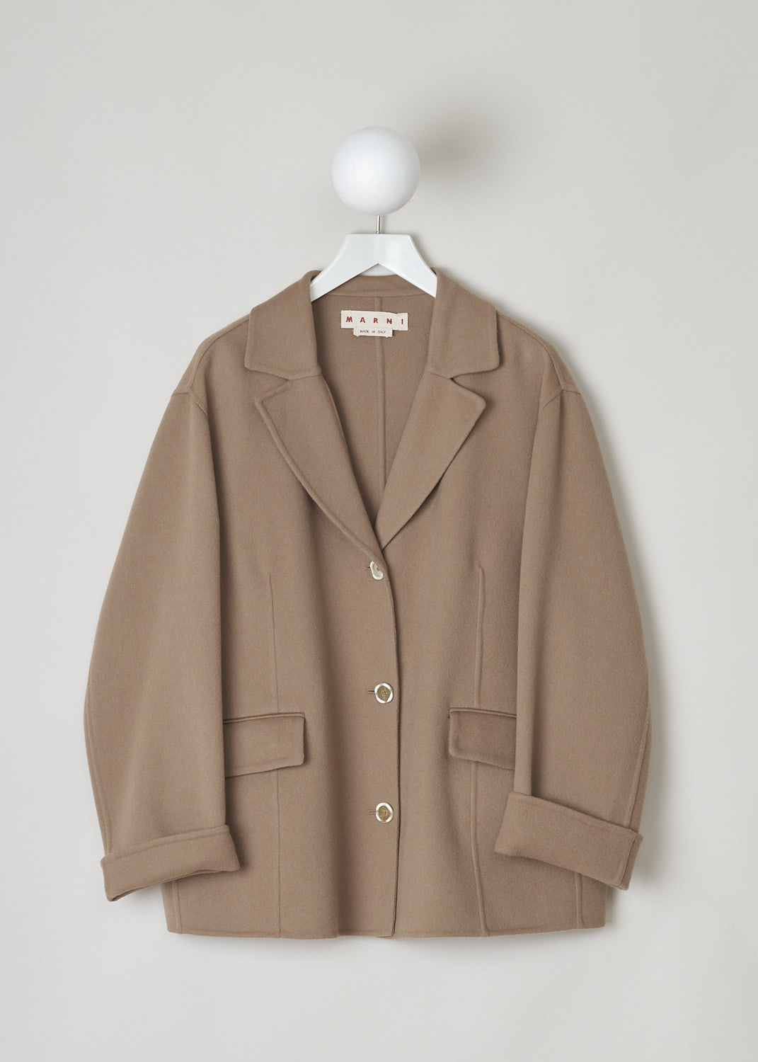 MARNI, CAMEL COLORED WOOL-BLEND COAT, GIMA0161KO_TW840_00M02, Brown, Front, This short camel-colored coat has an wider silhouette. The coat has a notched lapel and a front button closure. On the front, the coat has two welt pockets with flap. The long sleeves have rolled cuffs. The coat has a vertical centre seam across the back. 
