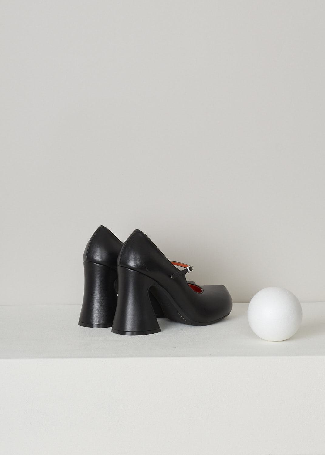 MARNI, BLACK LEATHER MARY JANE PUMPS, MJMS006210_P4545_00N99, Black, Back, These black leather Mary Jane pumps have an adjustable ankle strap closure with a silver-tone buckle, a chunky blocked heel and a round toe. The pumps have an orange leather lining.
  
