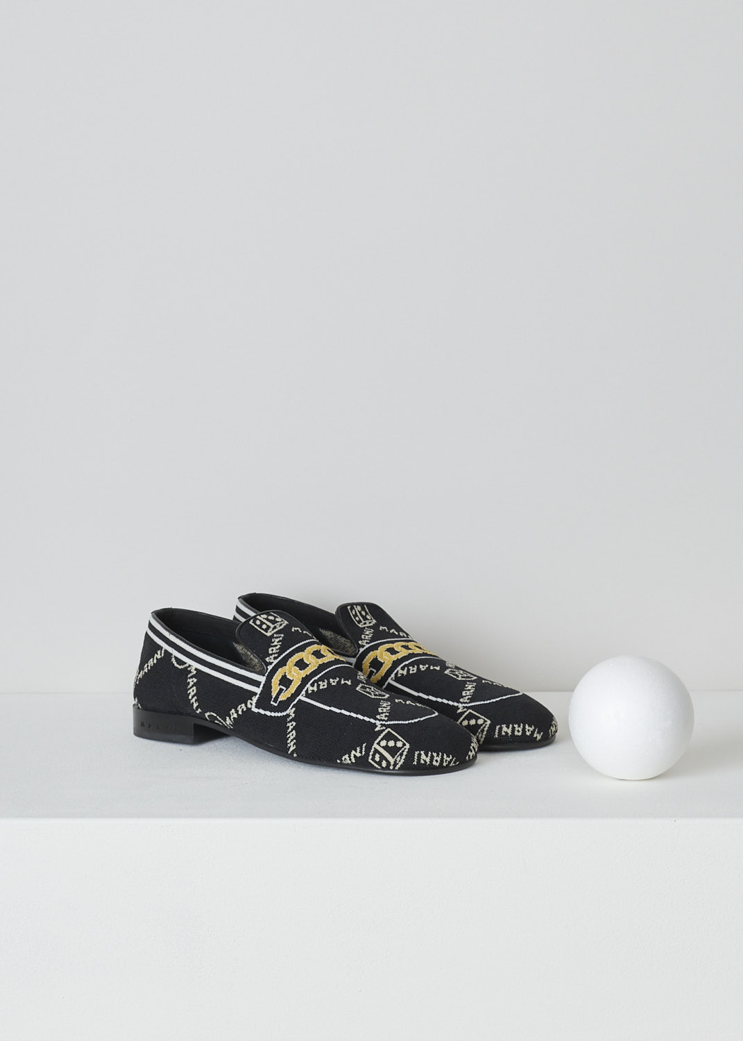 MARNI, BLACK TROMPE L'OEIL JACQUARD MOCCASINS, MOMS003601_P4601_Z2Q23, Black, Front, These black knitted moccasins have a trompe l'oeil image woven into them which depicts a gold chain across the vamp. The brand's logo is woven into them throughout the shoe in white. These moccasins have a round toe and flat rubber sole with a small heel. 
