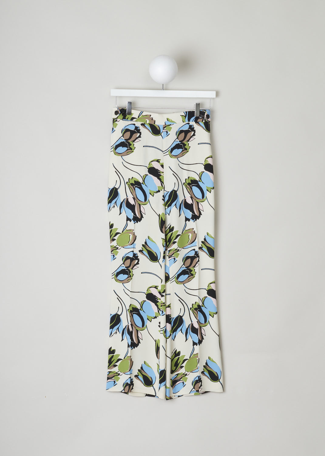 MARNI, CREME COLORED TROUSERS WITH FLORAL PRINT, PAMA0132Q0_UTV844_WIW03, Print, Front, These creme colored trousers have a floral print in shades of blues and reds. These trousers have a partly elasticated waistline, making for a comfortable fit. Also on the waistband are decorative buttons. A concealed side zipper functions as the closure option. The trousers have slanted pockets with contrasting black lining. 
