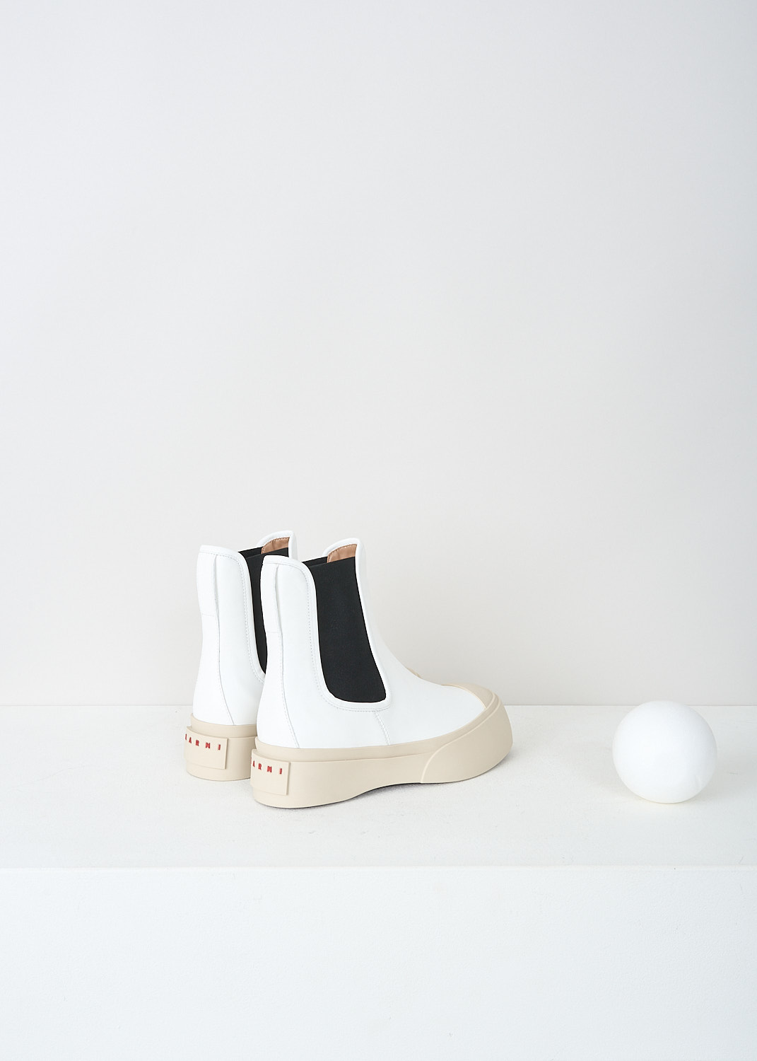 Marni, White Pablo Chelsea boot with black insert, TCZW000502_P2722_00W01, White, Back, These white Pablo Chelsea boots have black elasticated gusseted sides, a round toe and an off-white chunky sole with the brand's logo on the heel in red.
