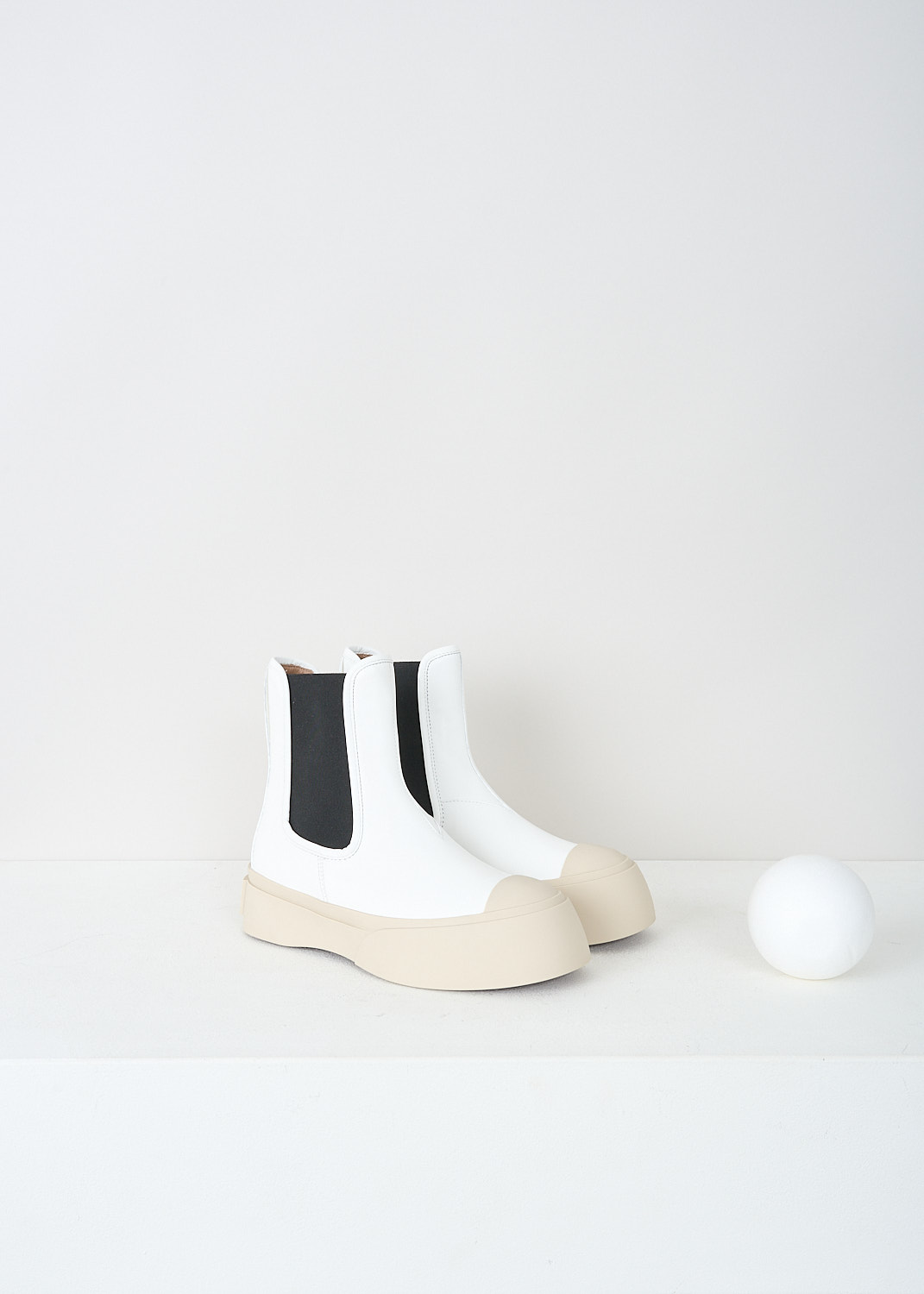 Marni, White Pablo Chelsea boot with black insert, TCZW000502_P2722_00W01, White, Front, These white Pablo Chelsea boots have black elasticated gusseted sides, a round toe and an off-white chunky sole with the brand's logo on the heel in red.
