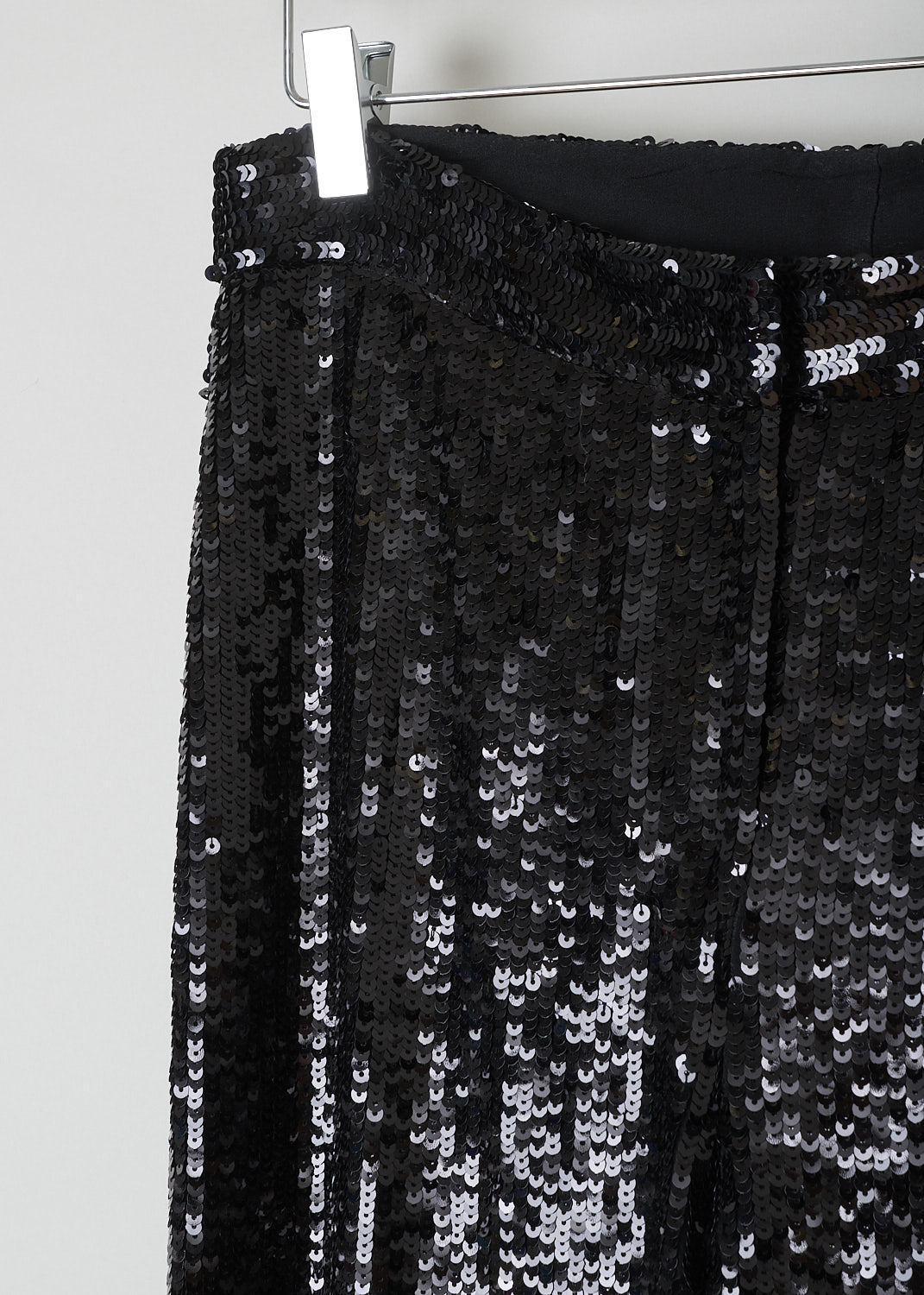 NILI LOTAN, BLACK SEQUIN PANTS, 12186_W688_BLACK, Black, Detail, These black pants are fully covered with see-through sequin. A concealed clasp and zip functions as the closure option. These pants have straight pant legs and are fully lined. 
