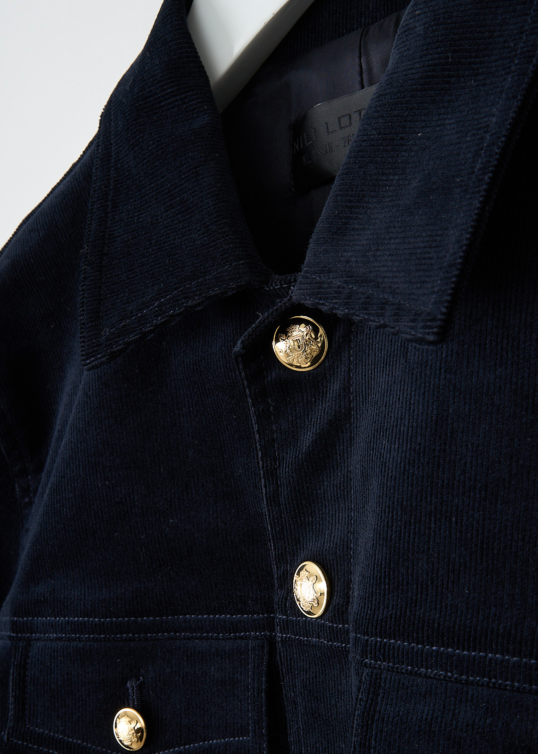 Nili Lotan, Midnight blue Lizeth jacket, LIZETH_JACKET_12674_W1530_MDT, Blue, Detail, This ribbed Midnight blue Lizeth jacket has a spread collar and a front button closure with gold-tone buttons. The long sleeves have buttoned cuffs. On the front, the jacket has four flap patch pockets,, all with those some gold-tone buttons. In the back, the jacket has adjustable button tabs.
