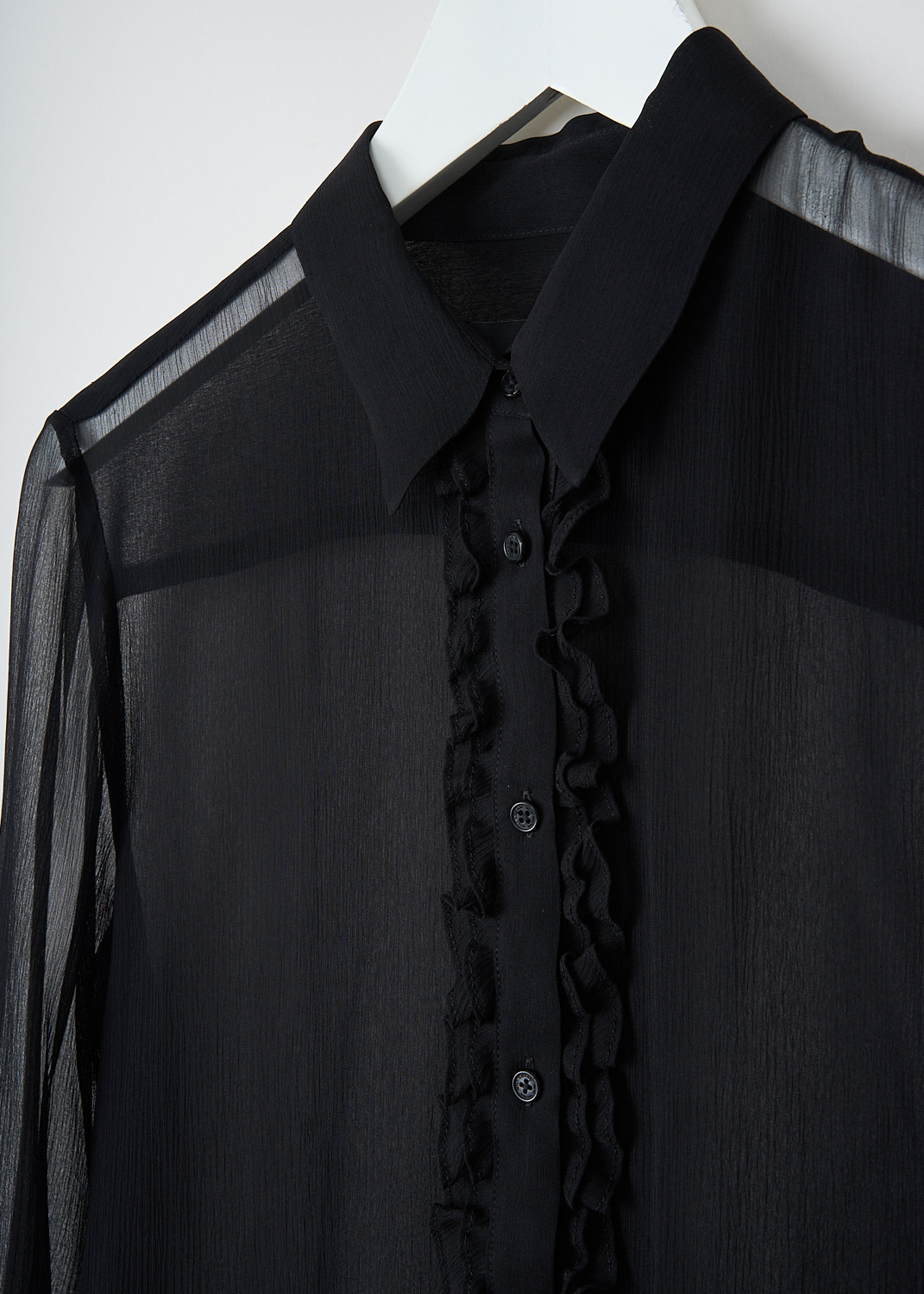 Nili Lotan, Kris see-through silk shirt in black, KRIS_SILK_SHIRT_12962_W1681_BLACK, Black, Detail, This Kris see-through silk shirt in black has a classic collar and a front button closure. The button placket is decorated with ruffles. The long sleeves have buttoned cuffs.
