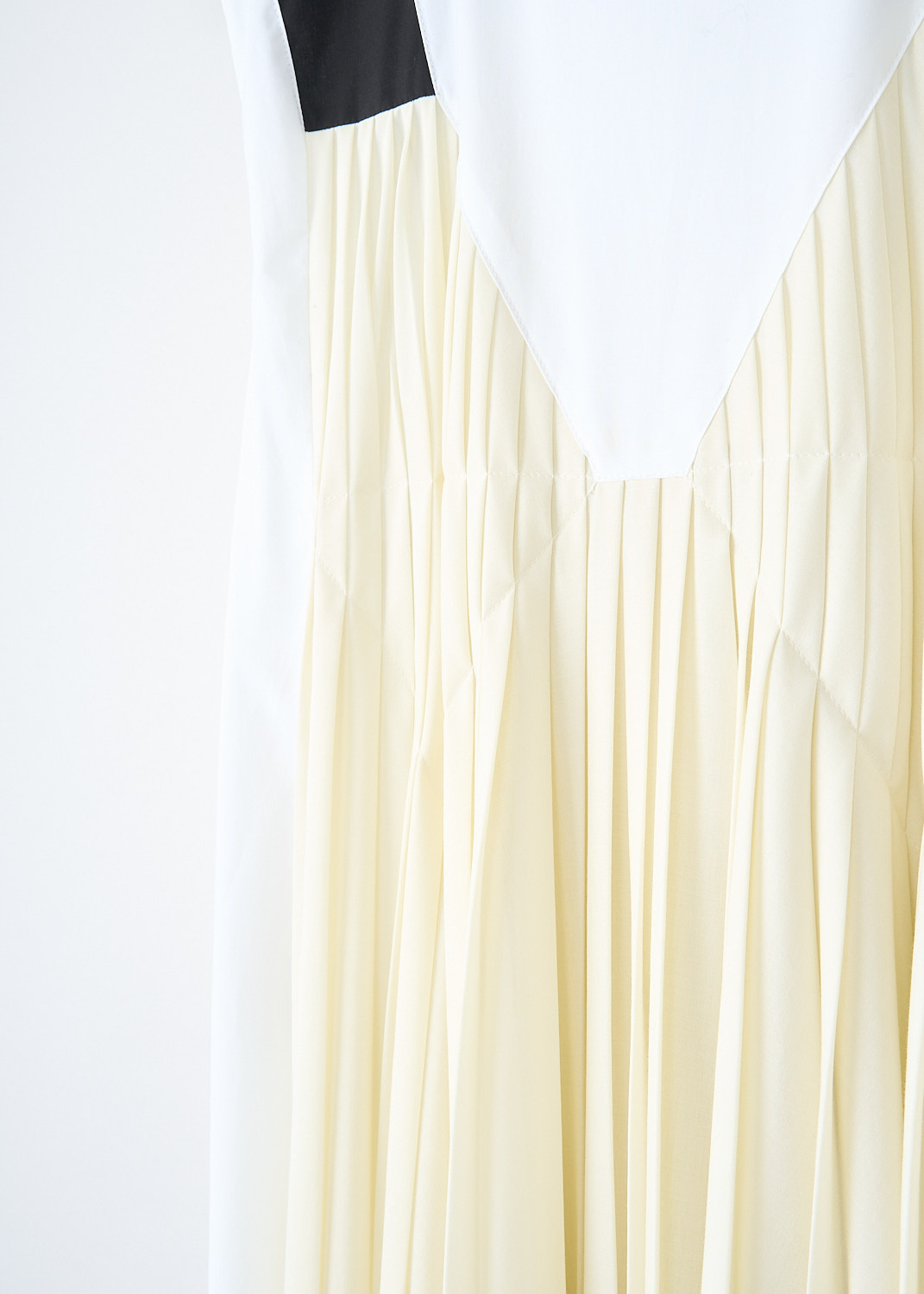 Plan C, Butter yellow pleated maxi dress, ABCAF05NE_HTP105_00W02, White, Yellow, Detail, This sleeveless pleated maxi dress has a high round neckline. The dress has a white cotton base with, both on the front and back, a pleated butter yellow fabric that creates the illusion of a slip dress with broad black straps. The dress has concealed slanted pockets. In the back, a concealed centre zip functions as the closure. 
